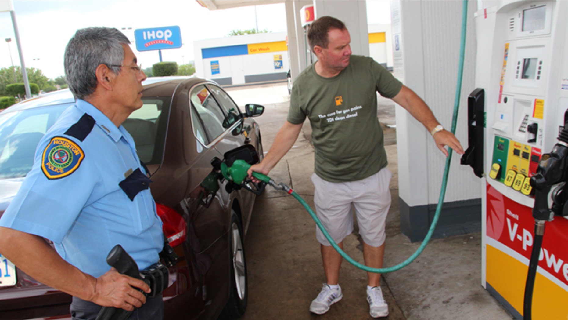 John Taylor fills up the Passat in Houston.