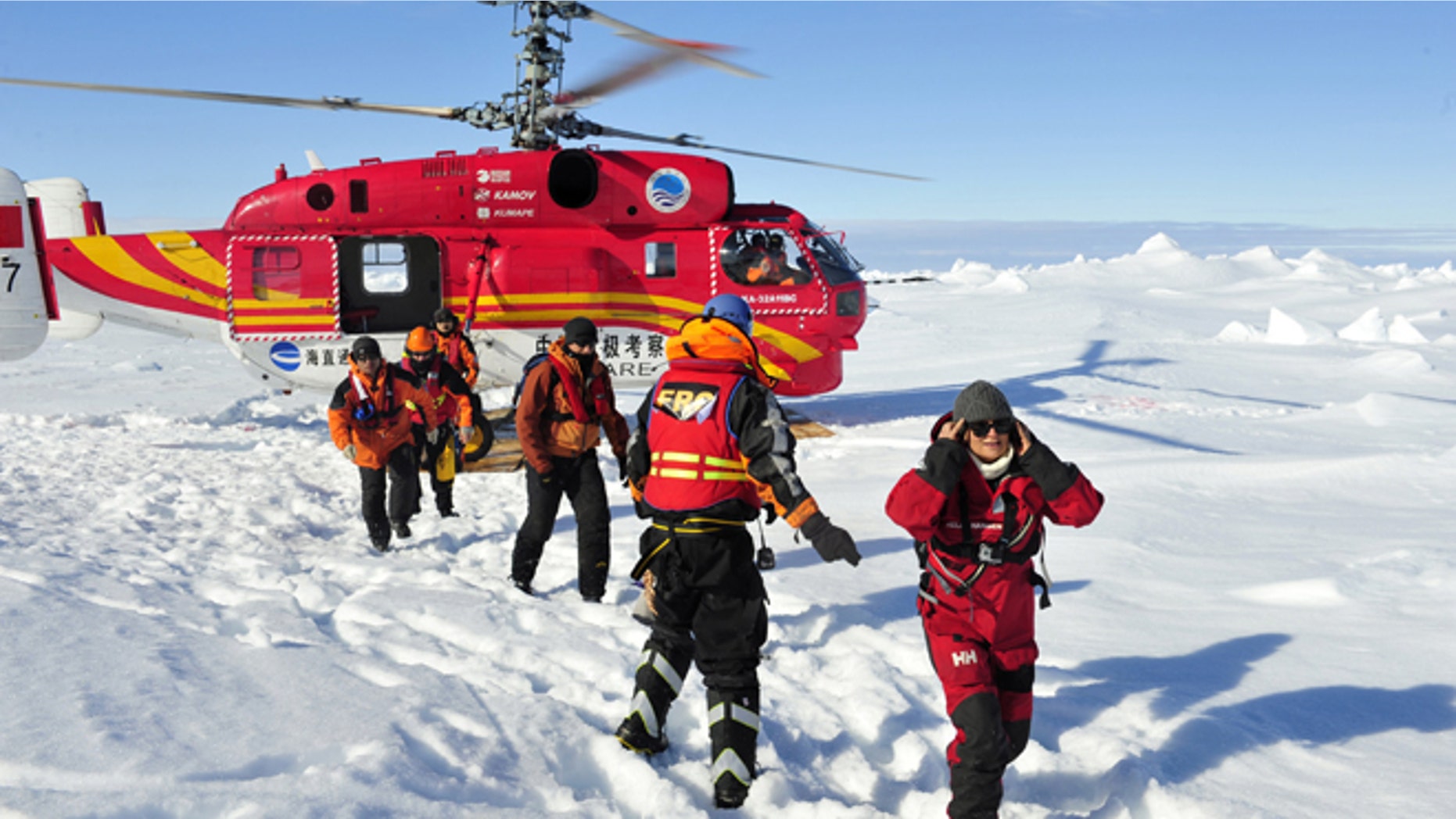 Jan. 2, 2014: In this photo provided by China's Xinhua News Agency, the first group of passengers who were aboard the trapped Russian vessel MV Akademik Shokalskiy arrive at a safe surface off the Antarctic.