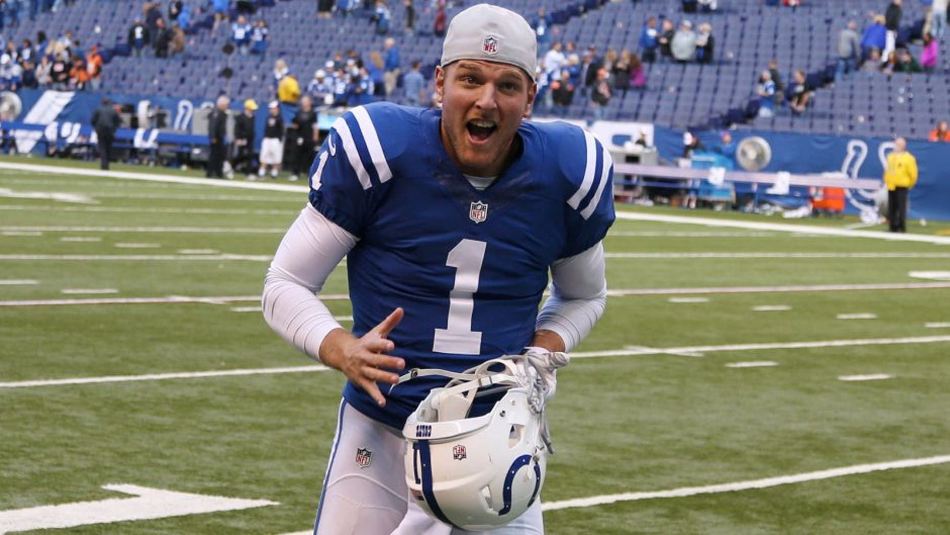 Oct 19, 2014; Indianapolis, IN, USA; Indianapolis Colts punter Pat McAfee (1) runs off the field after a game against the Cincinnati Bengals at Lucas Oil Stadium. Indianapolis defeats Cincinnati 27-0. Mandatory Credit: Brian Spurlock-USA TODAY Sports