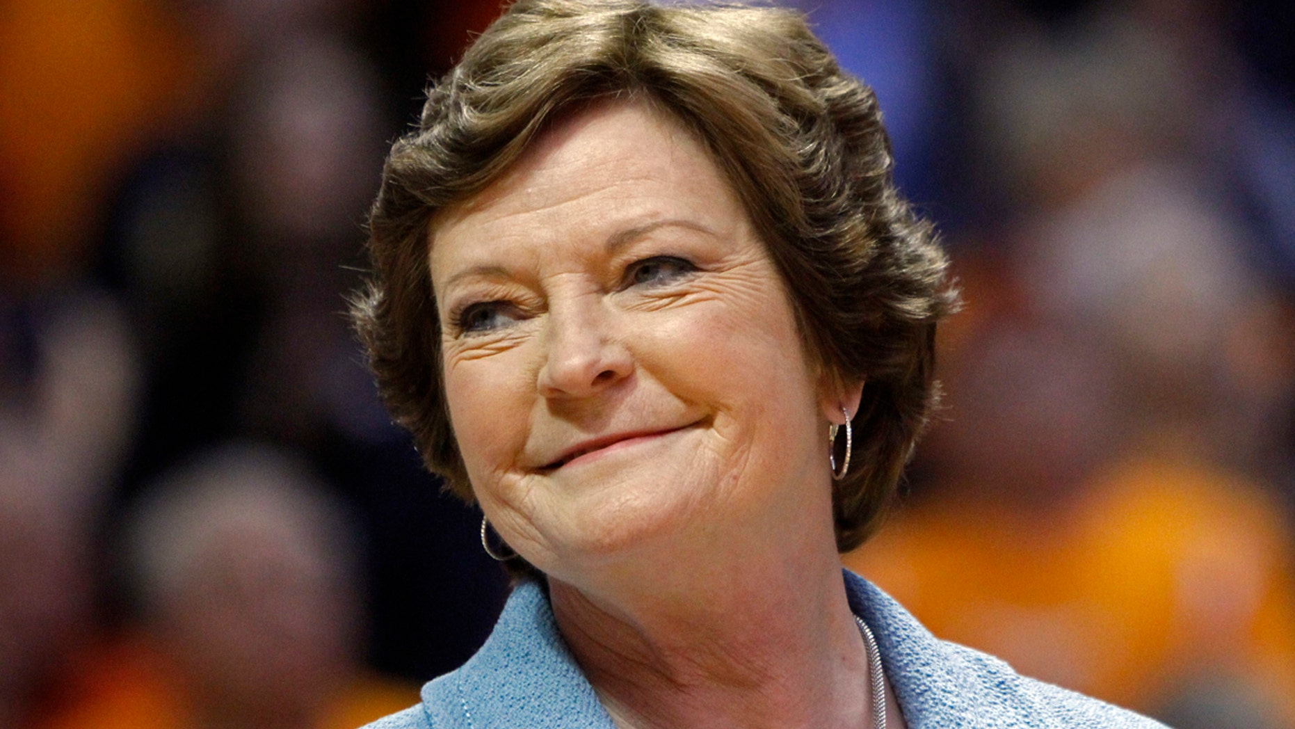 FILE - In this Jan. 28, 2013, file photo, former Tennessee women's basketball coach Pat Summitt smiles as a banner is raised in her honor before the team's NCAA college basketball game against Notre Dame in Knoxville, Tenn. Amid reports of Summitts failing health as her Alzheimers disease progresses, her family issued a statement Sunday, June 26, 2016, asking for prayers and saying that the former Tennessee womens basketball coach is surrounded by the people who mean the most to her. (AP Photo/Wade Payne, File)