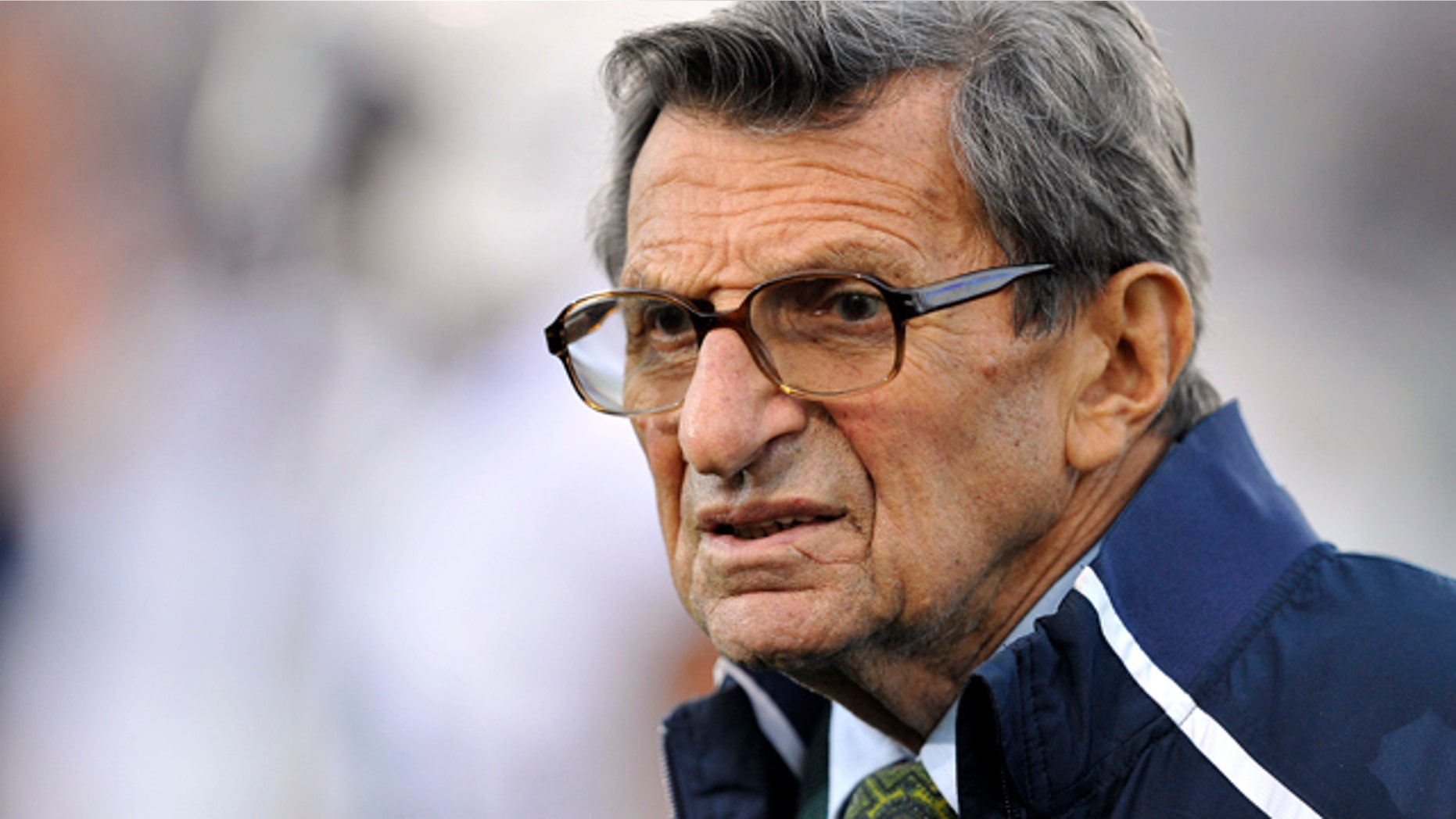 FILE - In this Oct. 22, 2011 file photo, Penn State coach Joe Paterno stands on the field before his team's NCAA college football game against Northwestern, in Evanston, Ill.