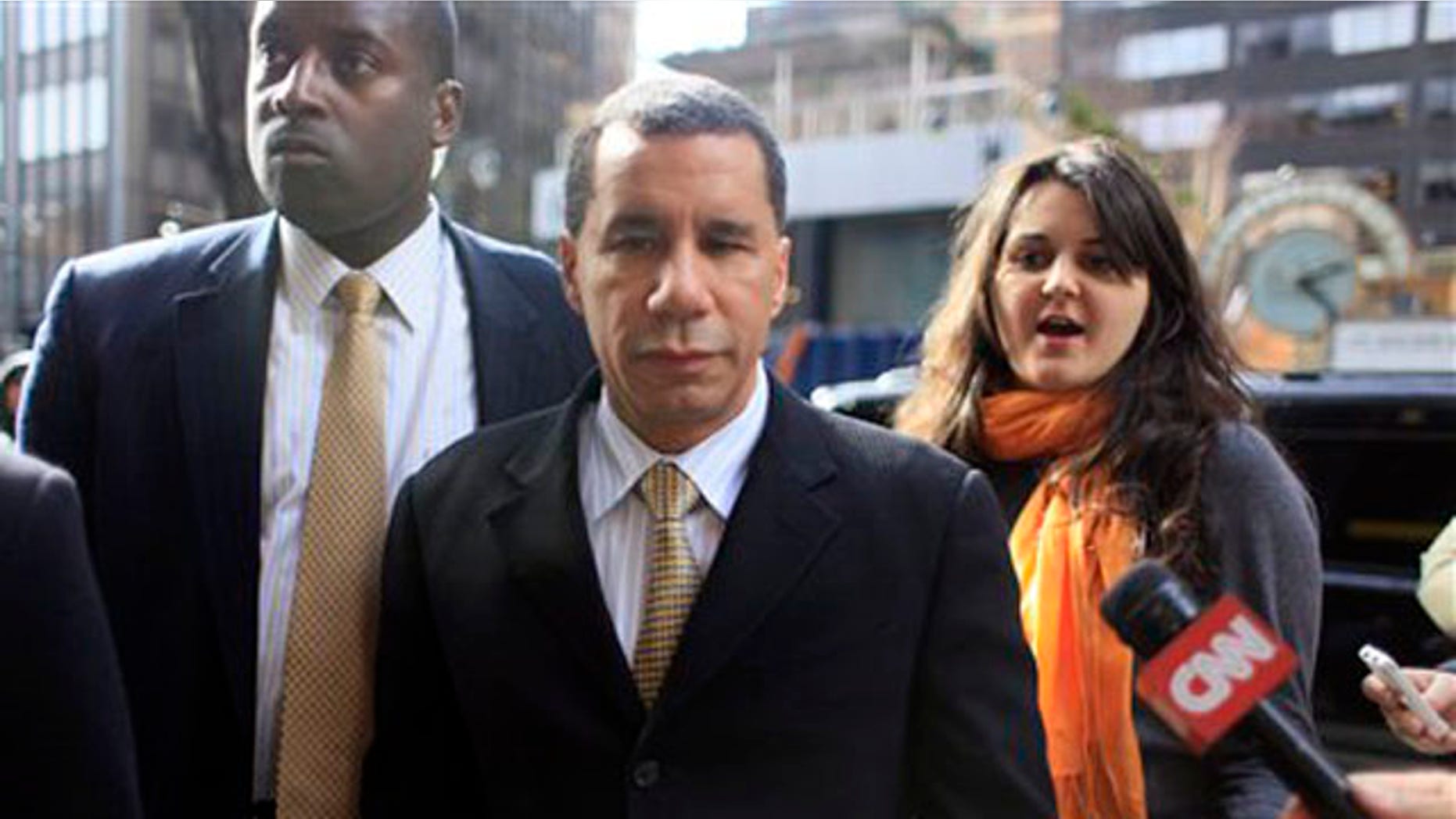 March 5, 2010: New York Gov. David Paterson, center, arrives at his midtown office (AP).