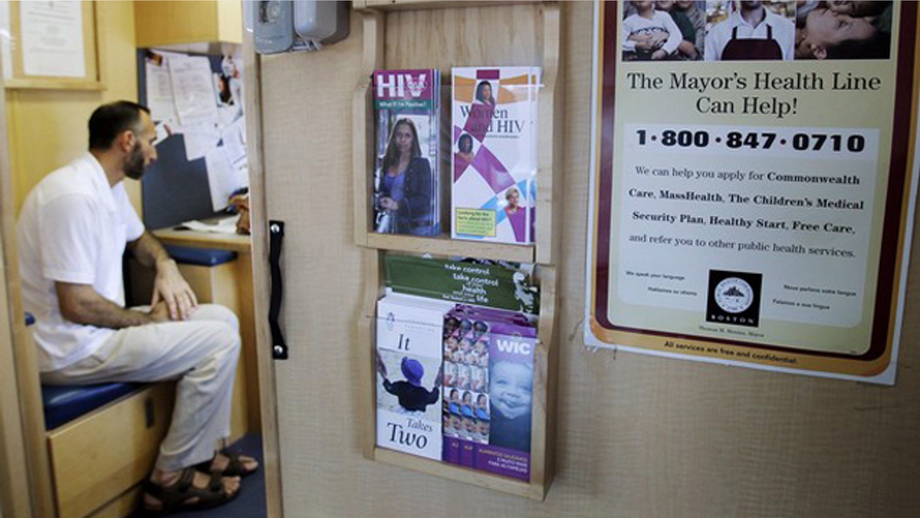 In this Aug. 9 photo, a patient waits to get his blood pressure checked in the Family Van in Boston, Mass. (Reuters Photo)