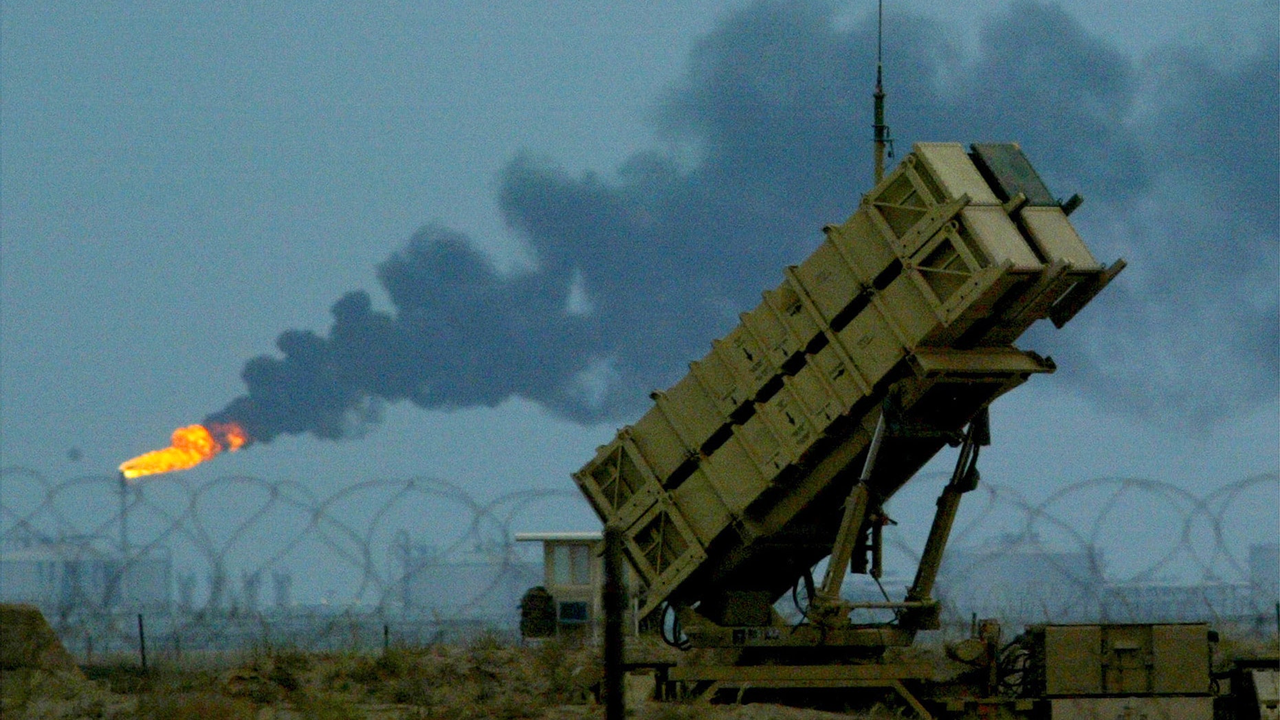 File photo - U.S manned Patriot missiles protect a nearby British and U.S airbase in front of the oilfields in Kuwait March 16, 2003. (REUTERS/Russell Boyce)