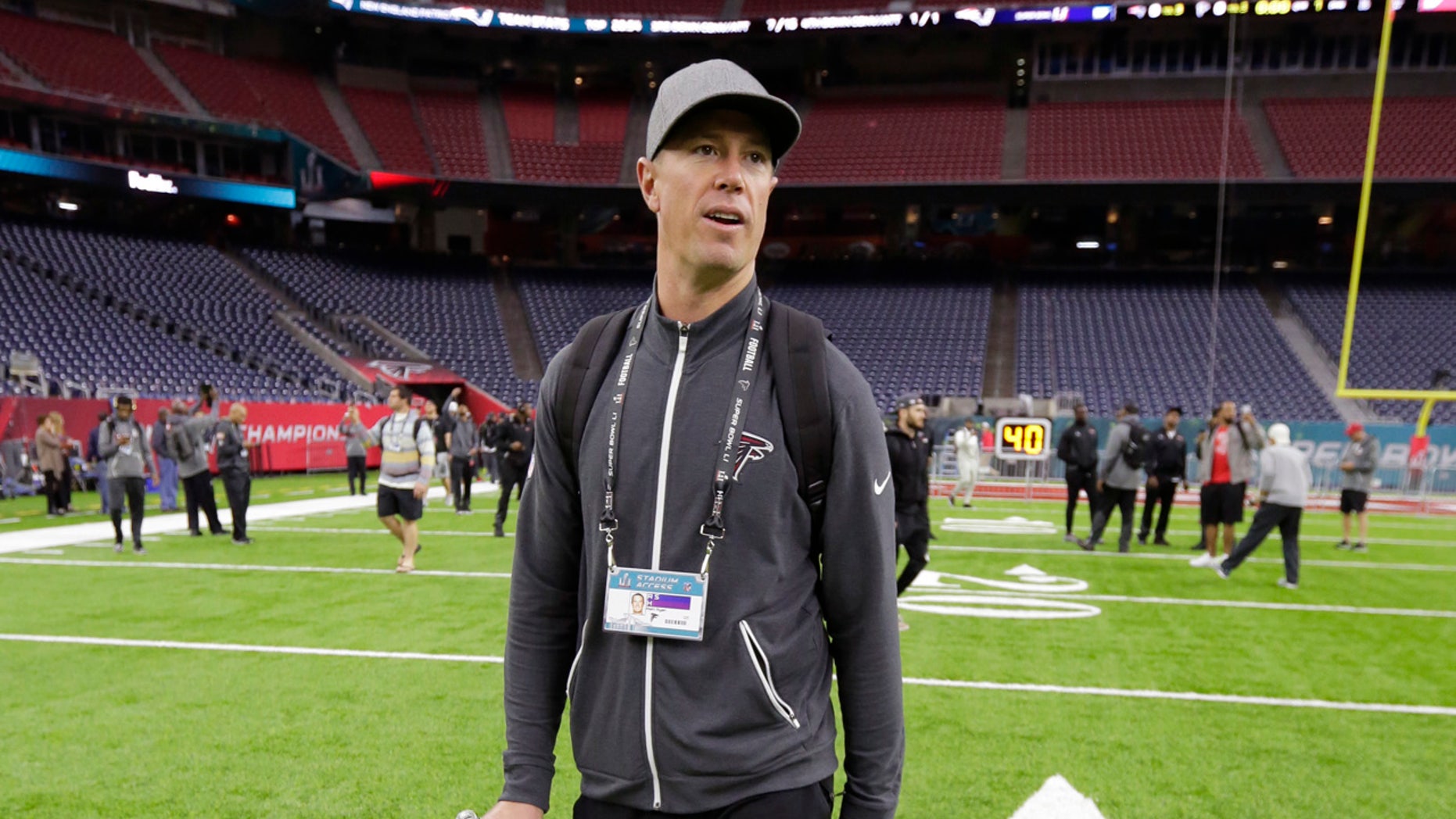 Atlanta Falcons quarterback Matt Ryan walks on the field during a visit to NRG Stadium for a walk through on the eve of NFL Super Bowl 51 football game Saturday, Feb. 4, 2017, in Houston.