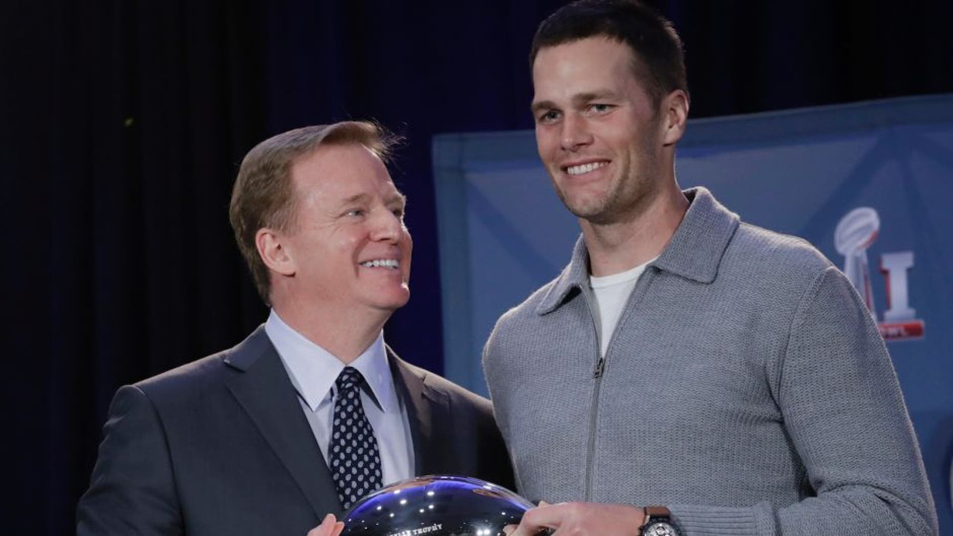 NFL commissioner Roger Goodell and New England Patriots quarterback Tom Brady pose with the MVP trophy during a news conference after the NFL Super Bowl 51 football game Monday, Feb. 6, 2017, in Houston. Brady was named the MVP of Super Bowl 51. (AP Photo/Morry Gash)