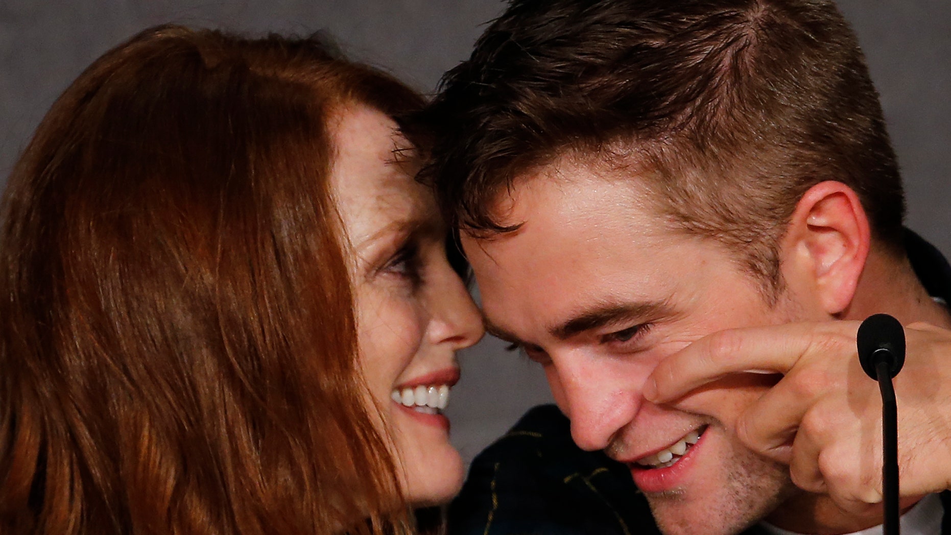 May 19, 2014. Cast members Robert Pattinson (R) and Julianne Moore attend a news conference for the film "Maps to the Stars" in competition at the 67th Cannes Film Festival in Cannes.