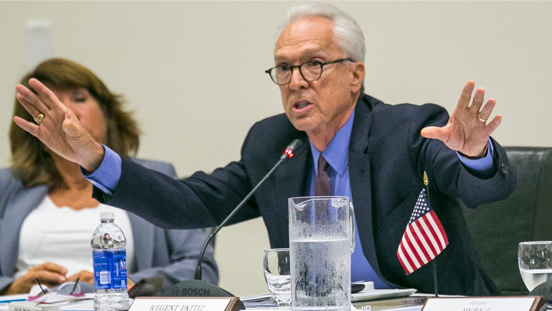 University of California Regent Norman Pattiz, right, addresses fellow board members in Irvine, Calif., Sept. 17, 2015.