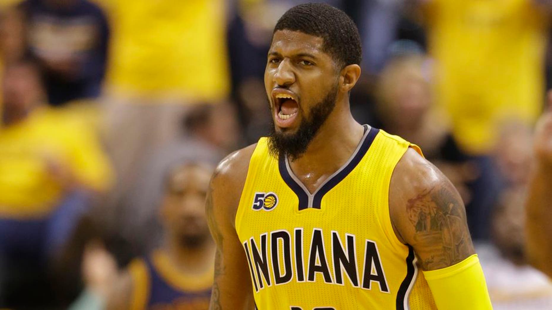 Indiana Pacers' Paul George reacts during the first half in Game 3 of a first-round NBA basketball playoff series against the Cleveland Cavaliers,Thursday, April 20, 2017, in Indianapolis. (AP Photo/Michael Conroy)