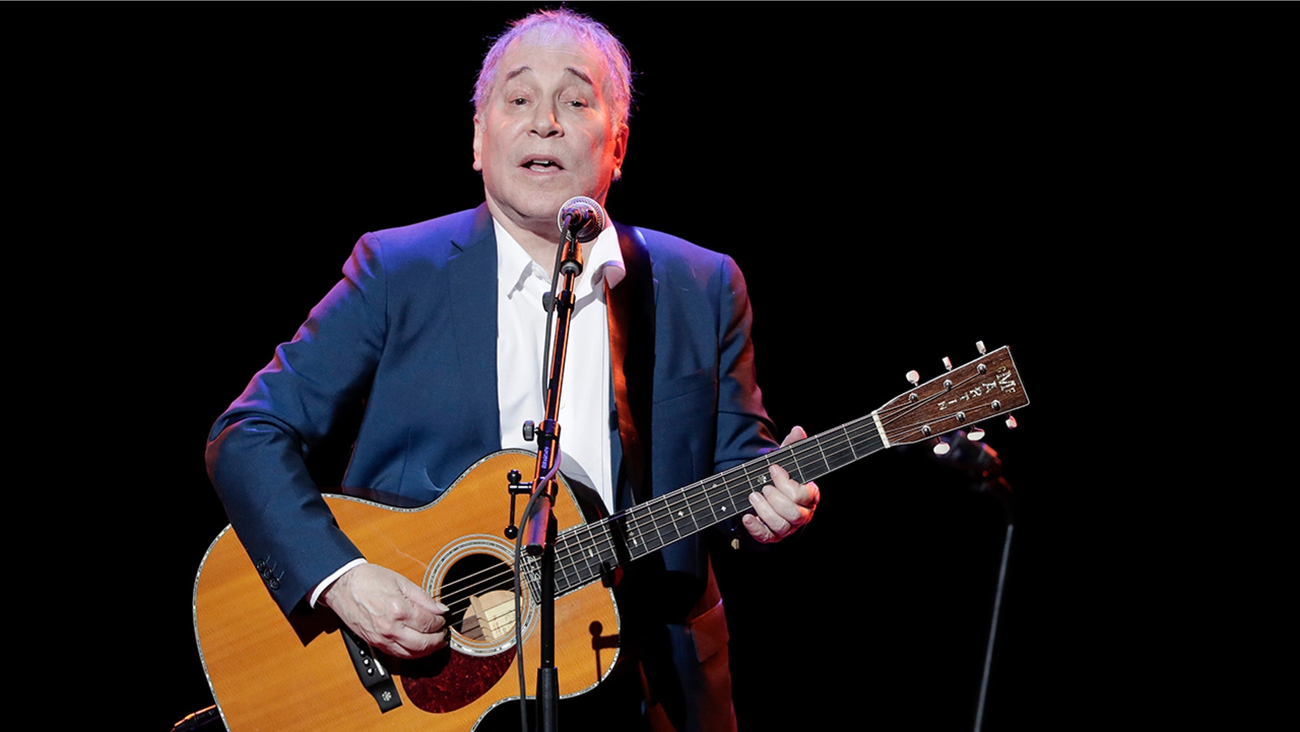 FILE - In a Sept. 22, 2016 file photo, musician Paul Simon performs during the Global Citizen Festival, in New York. On Monday, Feb. 5, 2018, Simon took to social media to say his upcoming tour will be his last, citing the personal toll of touring and the death of his lead guitarist, Vincent N'guini. (AP Photo/Julie Jacobson, File)
