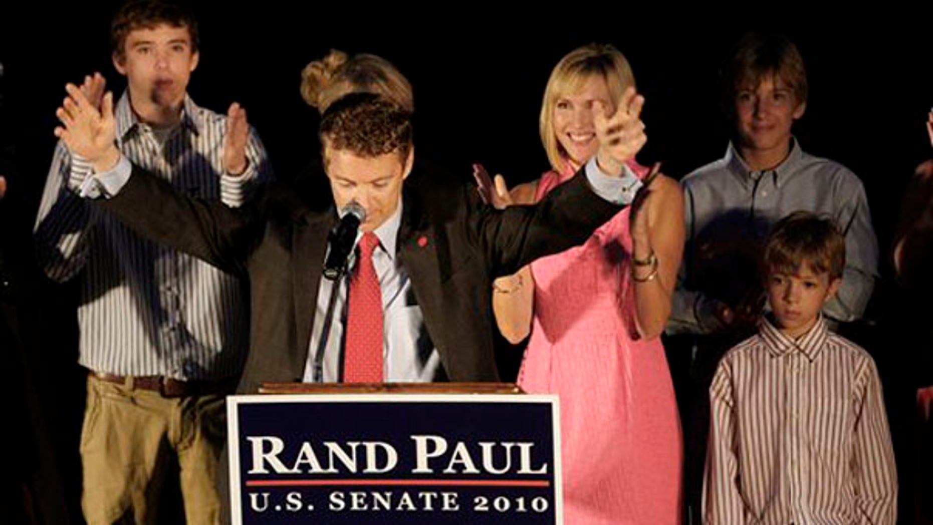 Senate candidate Rand Paul raises his arms at his victory party in Bowling Green, Ky., May 18. (AP Photo)