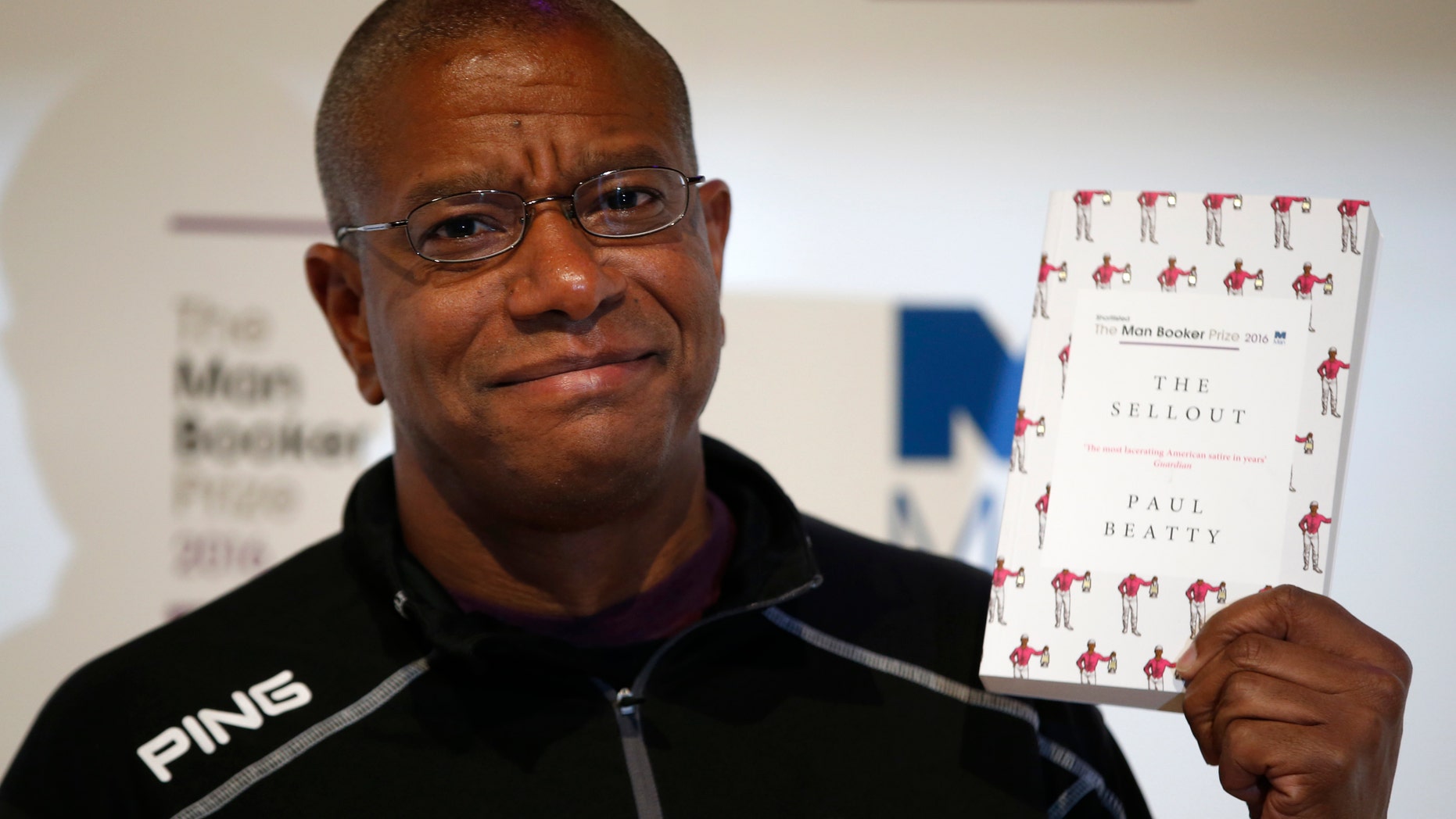 Writer Paul Beatty poses with his book "The Sellout"