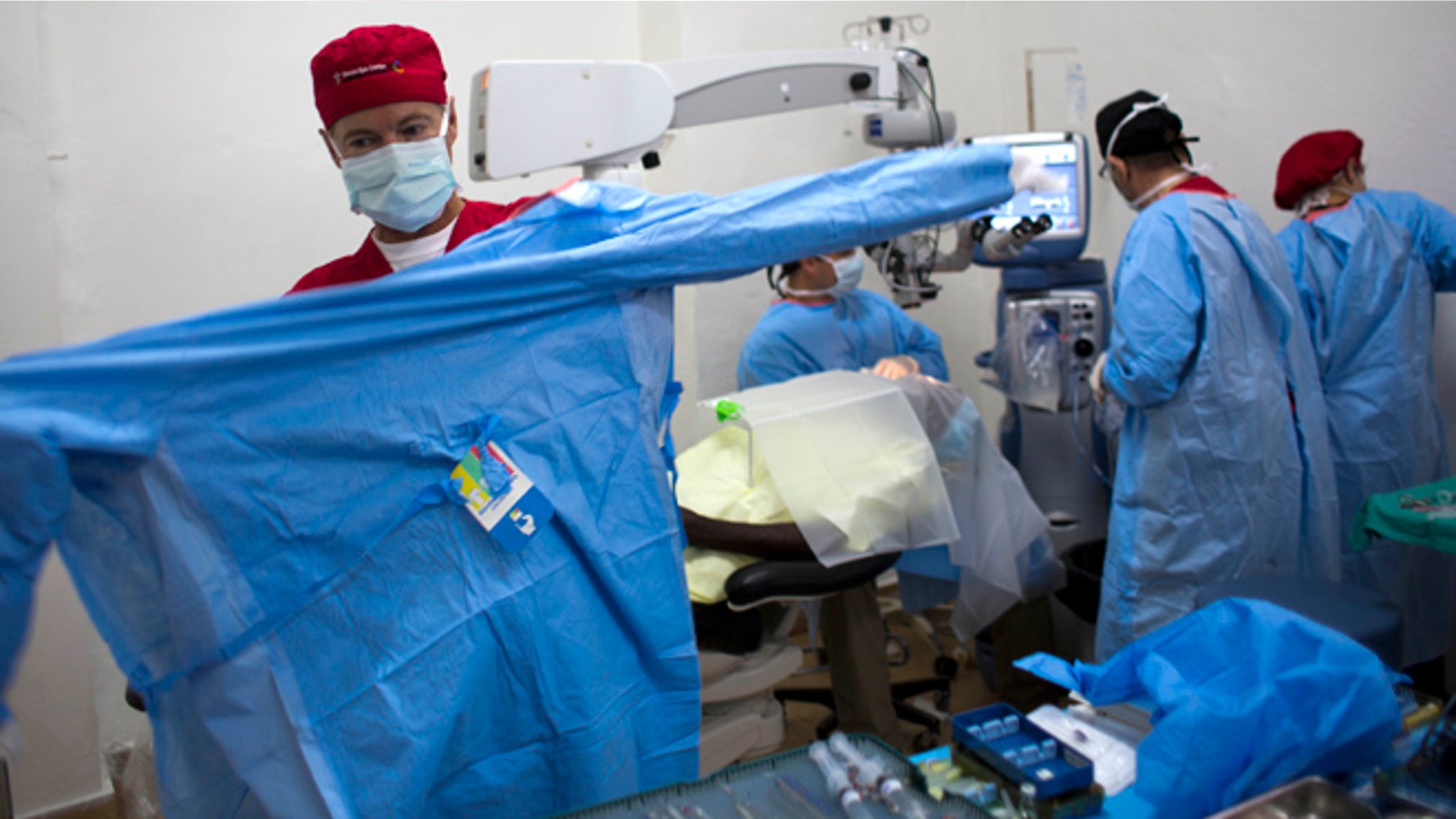 Aug. 17, 2015: Republican presidential candidate, Sen. Rand Paul, R-Ky. puts on scrubs to perform cataract surgeries in Cap-Haitien, Haiti. (AP)