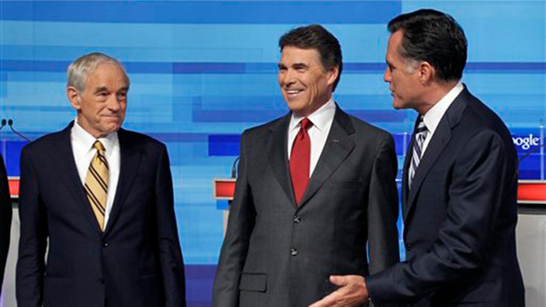 Sept. 22: Republican presidential candidates Rep. Ron Paul, Texas Gov. Rick Perry and former Massachusetts Gov. Mitt Romney greet each other prior to the Fox News/Google debate in Orlando, Fla.