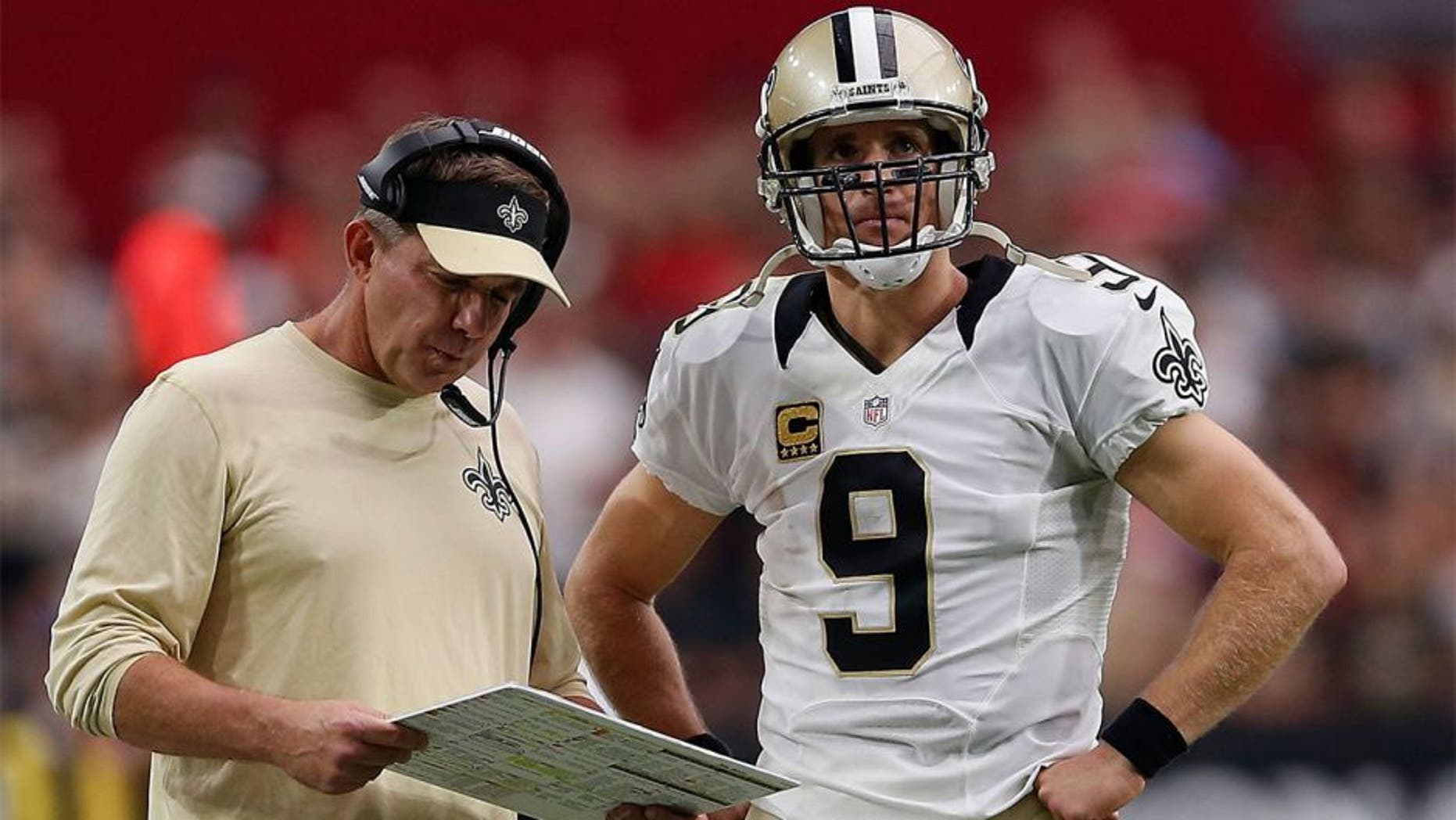 GLENDALE, AZ - SEPTEMBER 13: Head coach Sean Payton of the New Orleans Saints (left) talks with quarterback Drew Brees #9 during the second half of the NFL game against the Arizona Cardinals at the University of Phoenix Stadium on September 13, 2015 in Glendale, Arizona. The Cardinals defeated the Saints 31-19. (Photo by Christian Petersen/Getty Images)