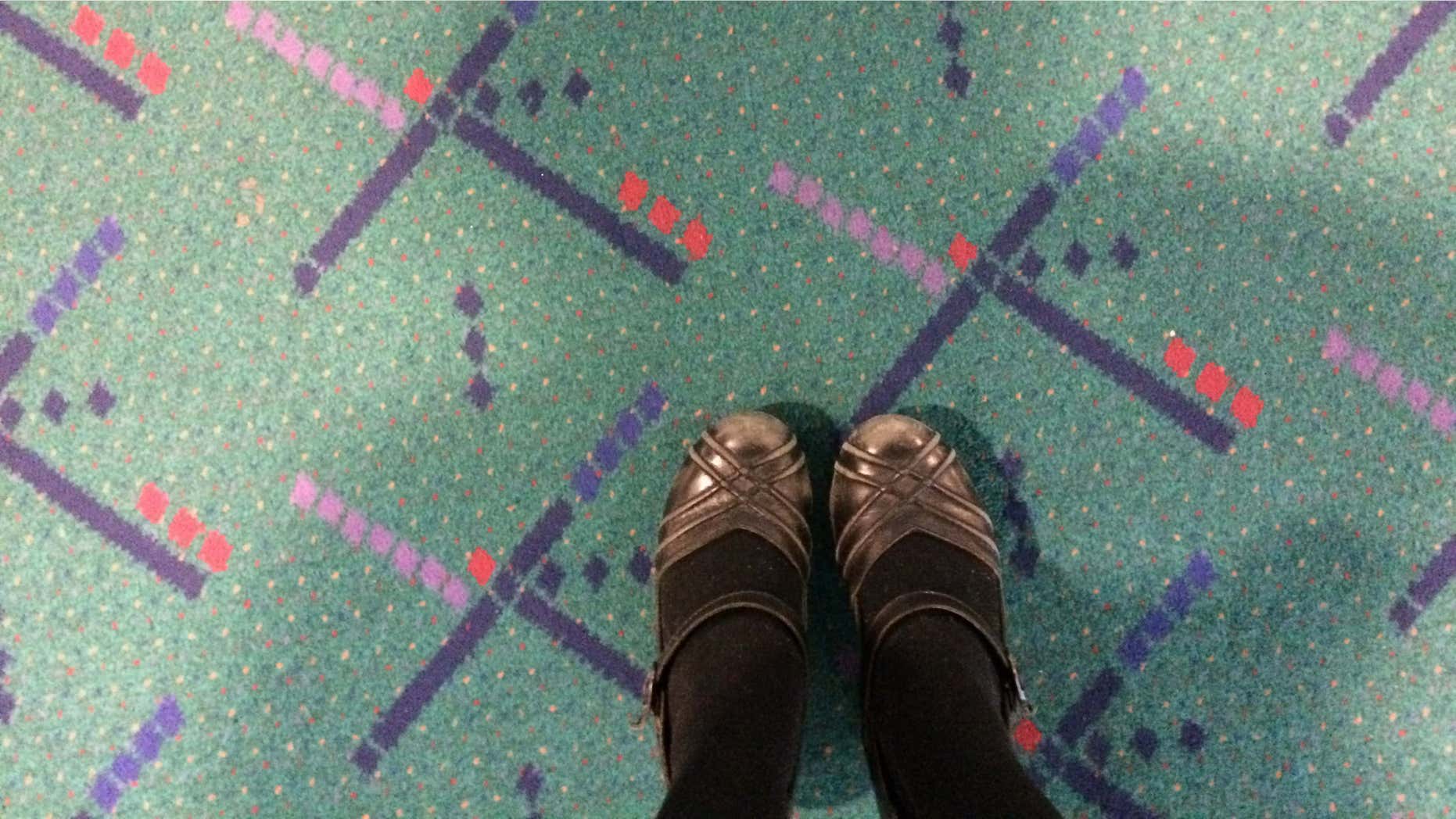 Jan. 23, 2015: This selfie taken by Julie Sabatier, at Portland International Airport in Portland, Ore., shows her feet on older carpet due to be replaced at the terminal.