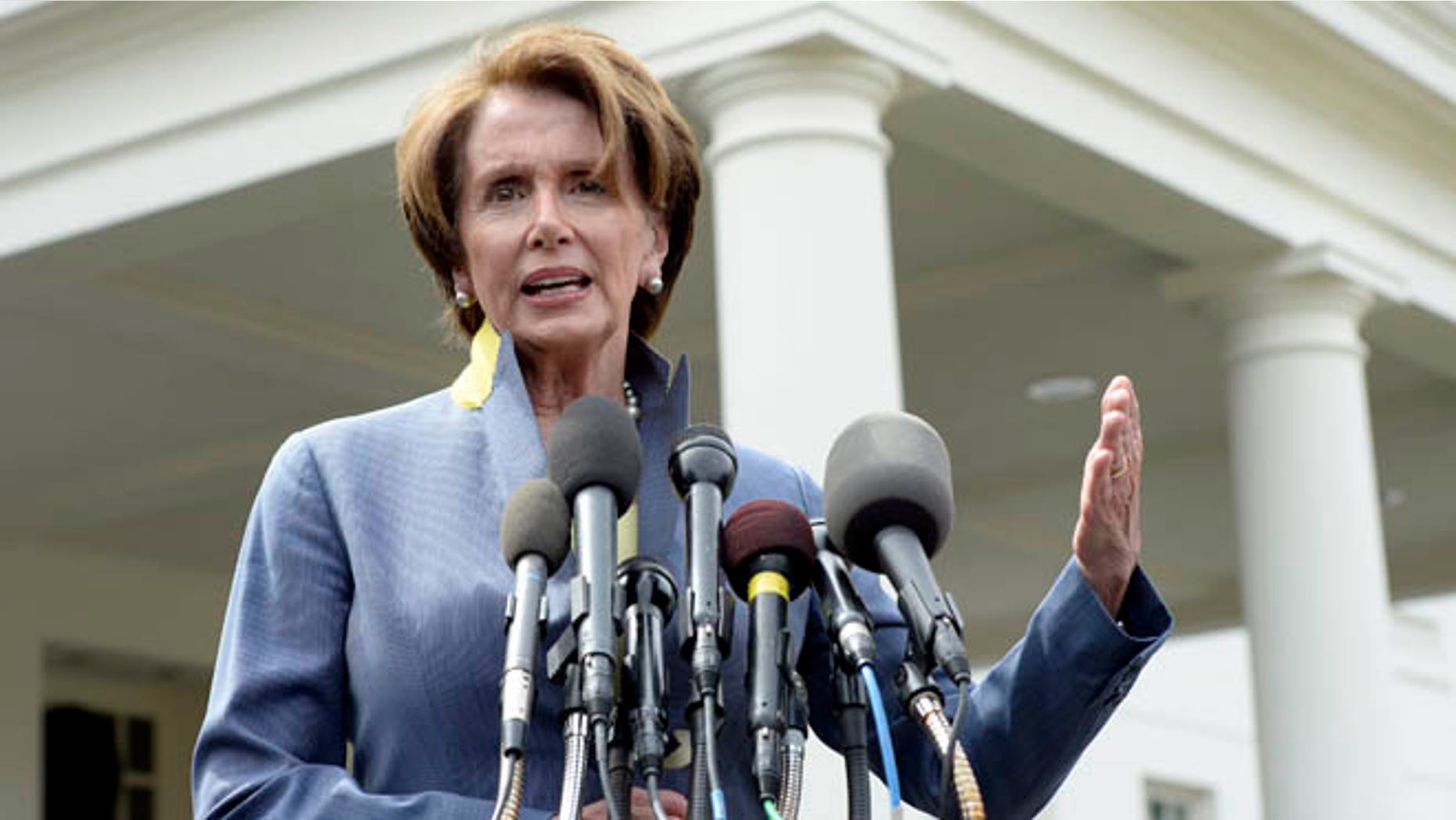 April 1, 2014: House Minority Leader Nancy Pelosi speaks to reporters outside the West Wing of the White House.