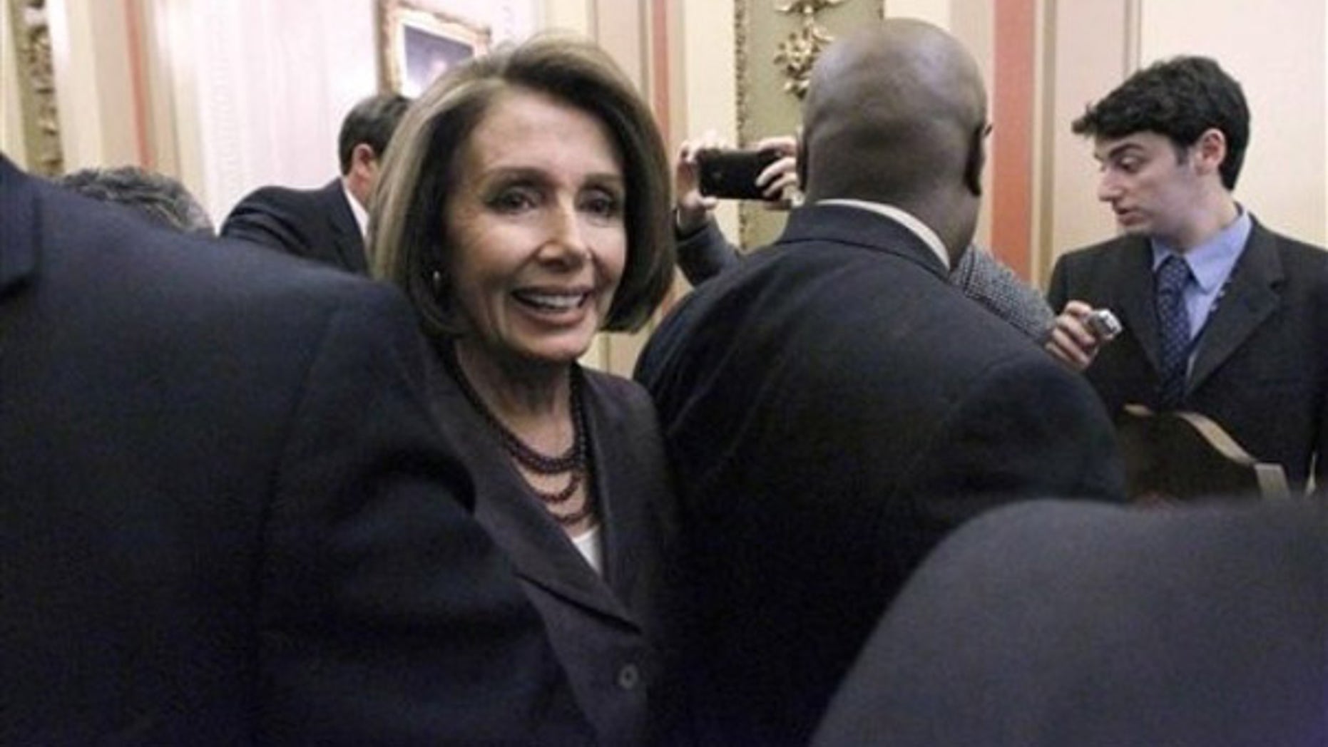 FILE: House Speaker Nancy Pelosi, D-Calif., heads to a television interview on Capitol Hill in Washington on Nov. 3.