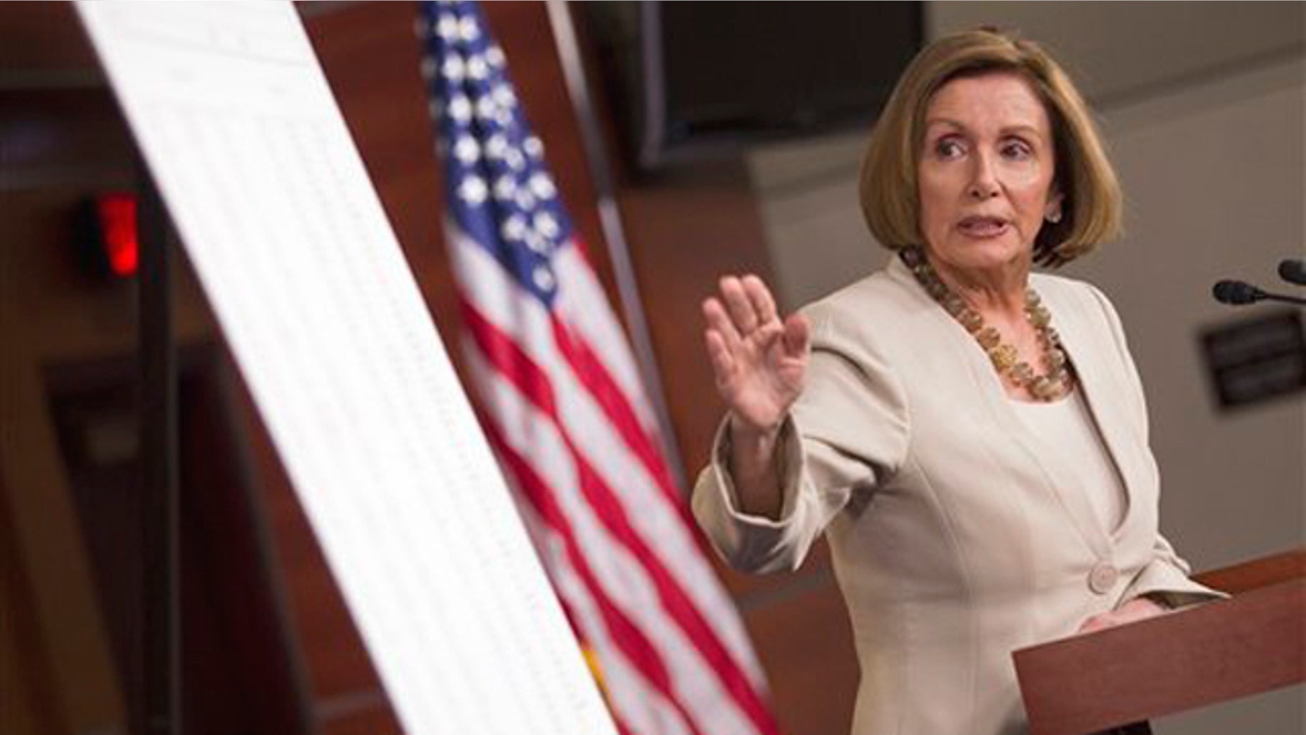House Minority Leader Nancy Pelosi points to a chart during a news conference on Capitol Hill in Washington May 12.