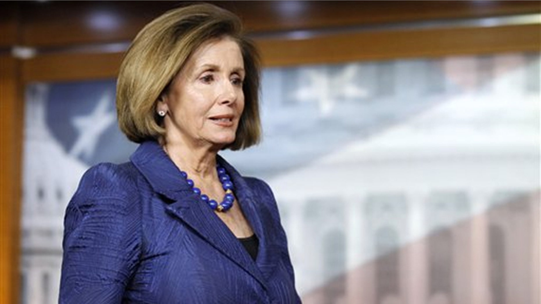 House Minority Leader Nancy Pelosi arrives for a news conference on Capitol Hill April 7.