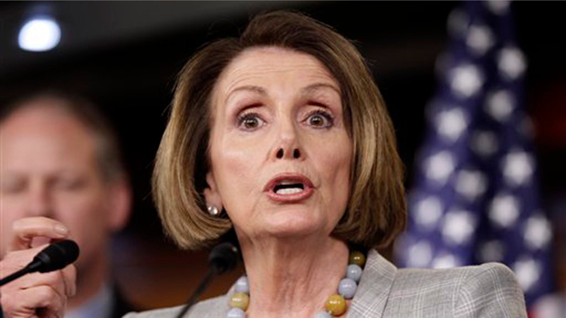 House Minority Leader Nancy Pelosi speaks to reporters June 16 on Capitol Hill in Washington.