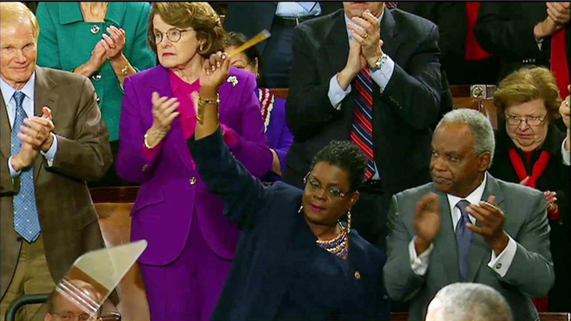 Jan. 20, 2015: Rep. Gwen Moore, D-Wis. waves a pencil in solidarity with the Charlie Hebdo victims during President Obama's State of the Union address.