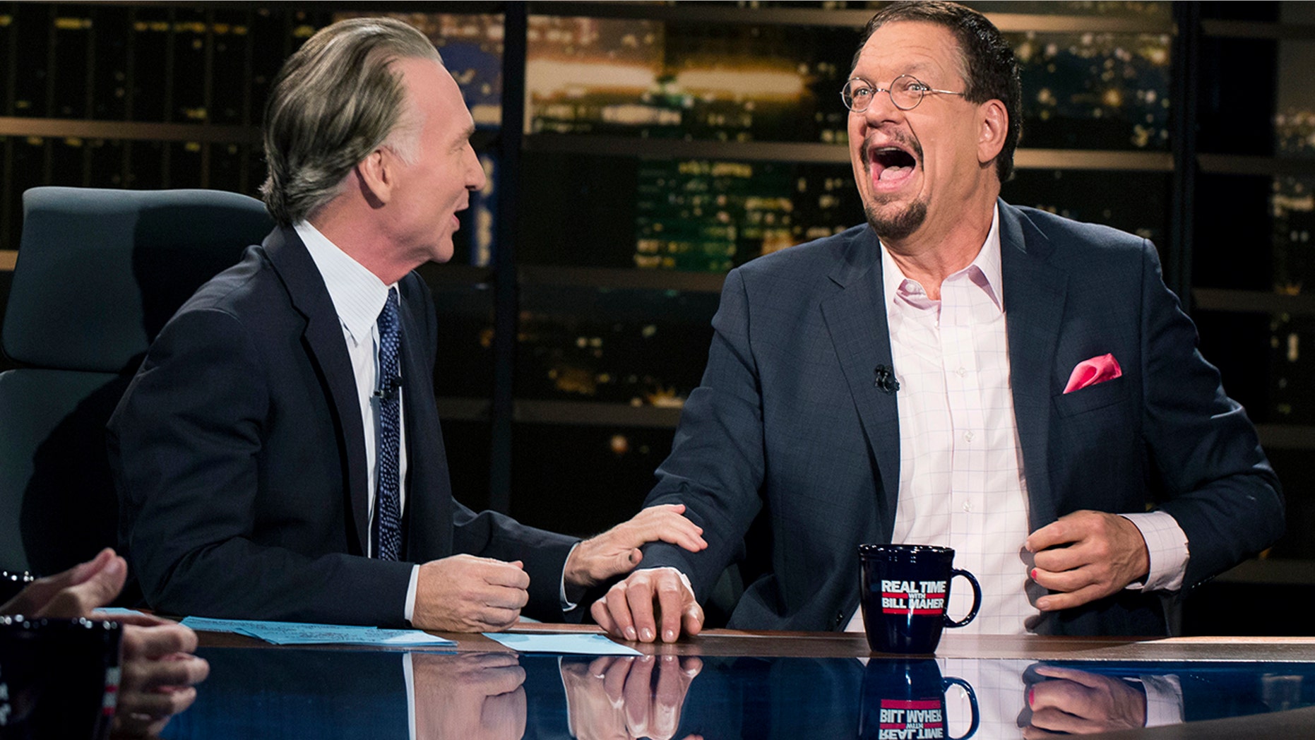 In this Friday, Aug. 18 , 2017 photo provided by HBO, Penn Jillette, right, appears on Bill Maher's âReal Time,â in Los Angeles. Jillette is apologizing profusely for his wisecracks insulting Newfoundland. The talkative half of the Penn & Teller magic and comedy act called Newfoundland, quote, "a euphemism for stupid" during Friday's "Overtime with Bill Maher," an online follow-up to Maherâs weekly âReal Timeâ talk show on HBO.