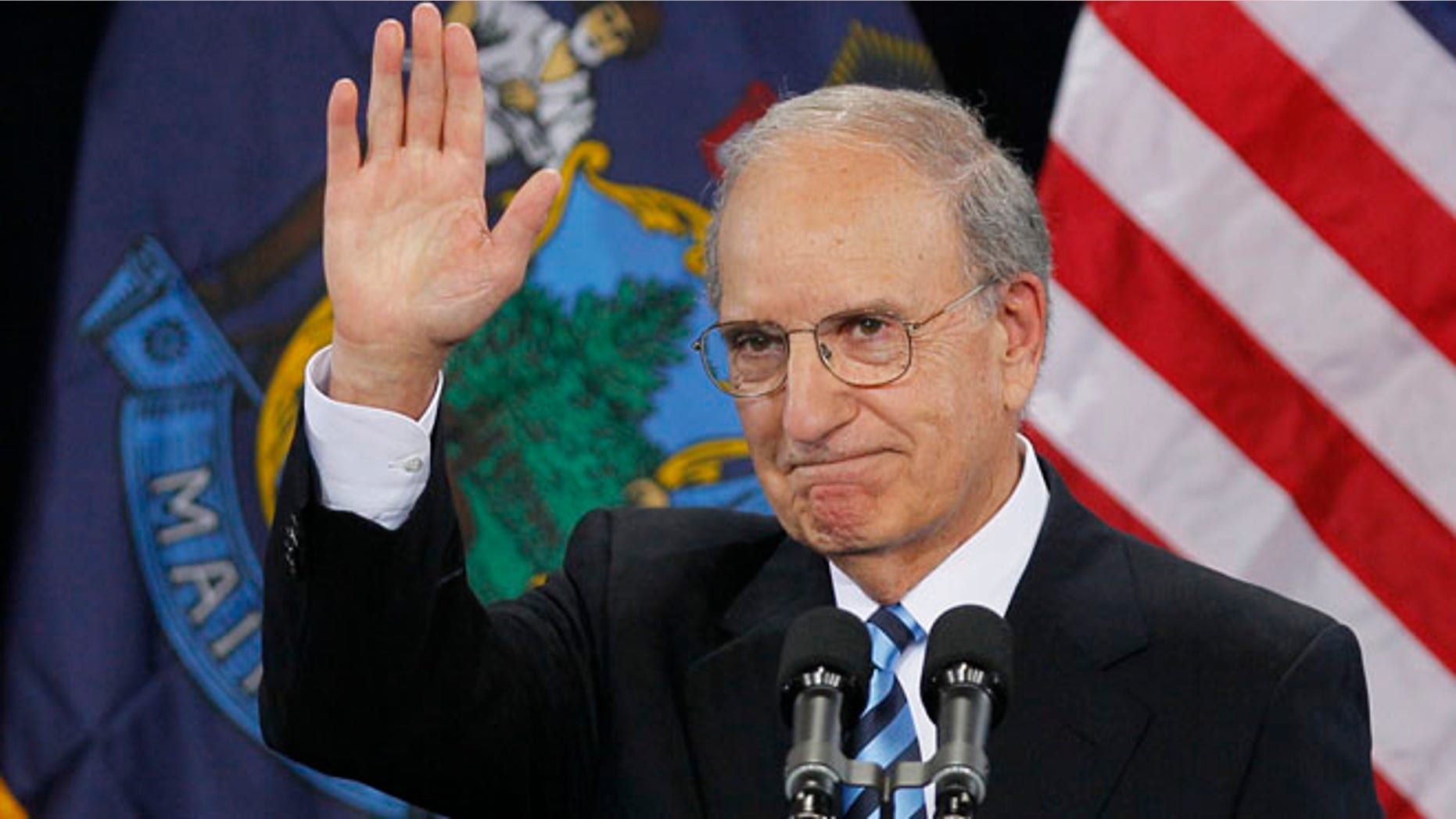 In this March 30, 2012 file photo, former Senate Majority Leader George Mitchell acknowledges the crowd after speaking at a campaign stop for President Obama at Southern Maine Community College in South Portland, Maine.