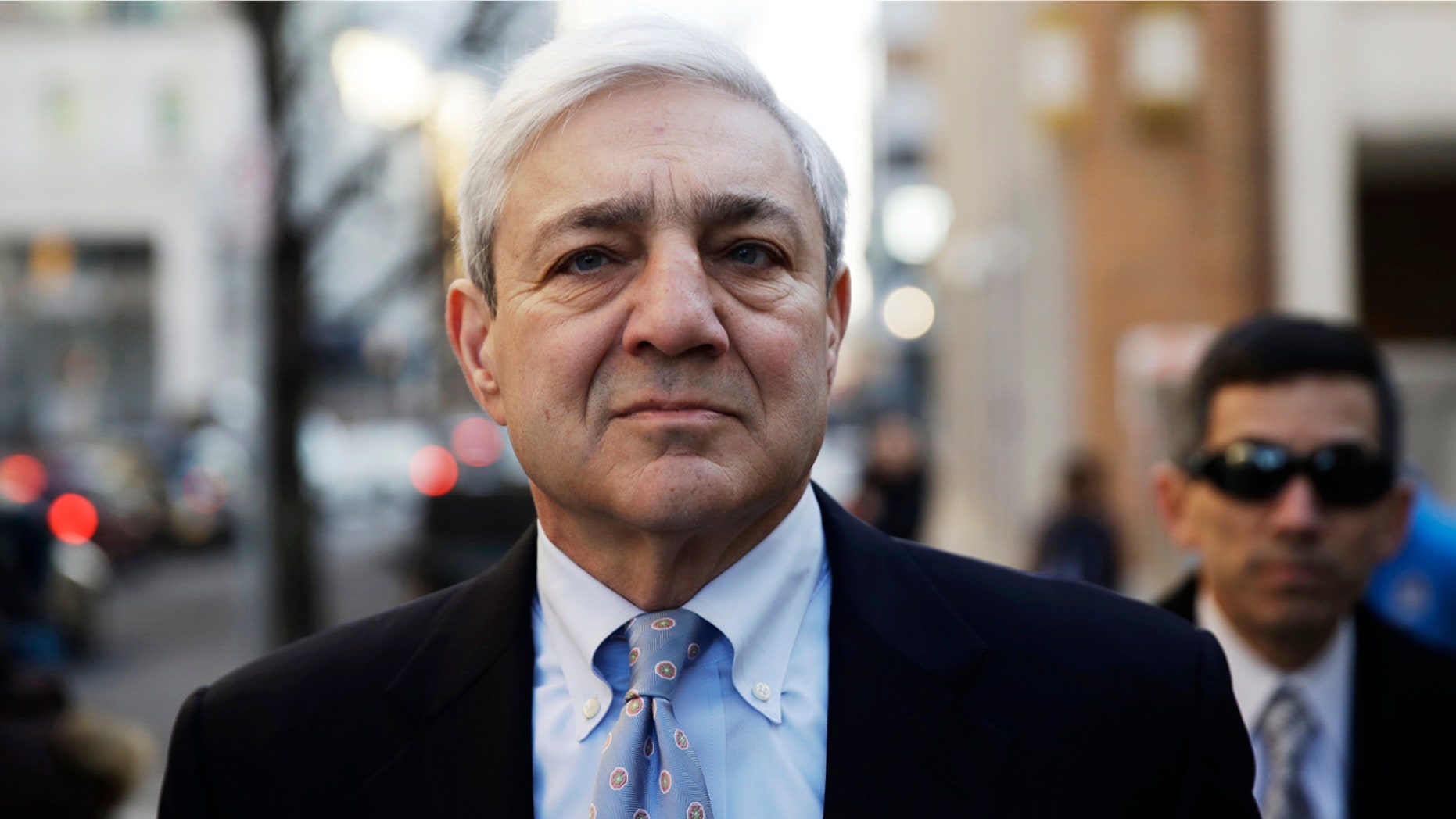 Former Penn State president Graham Spanier walks to the Dauphin County Courthouse in Harrisburg, Pa., Monday, March 20, 2017.