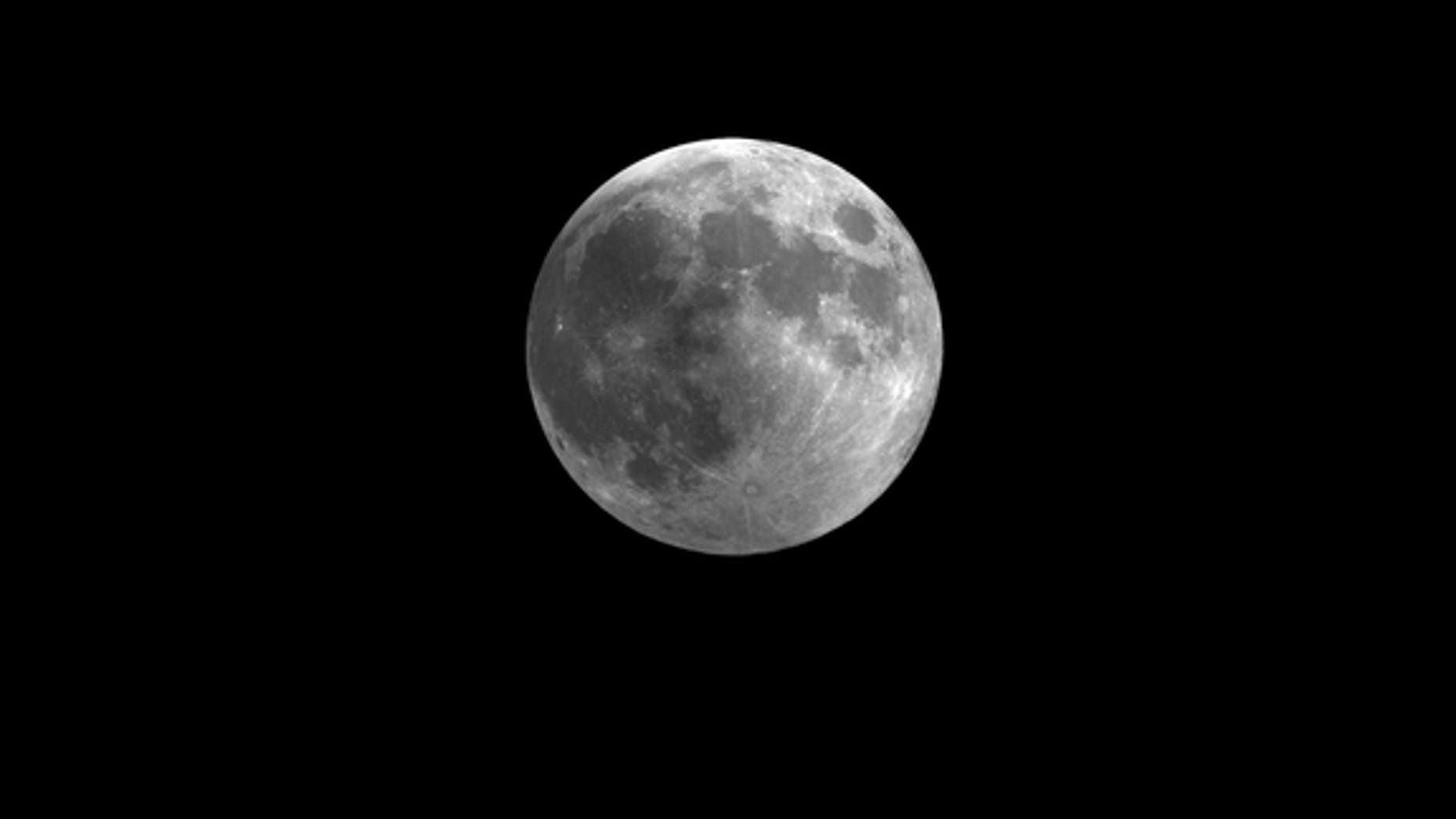 This still from a video skywatching guide shows how the penumbral lunar eclipse of Nov. 28 will slightly darken the full moon. The video guide is a monthly resource by the Space Telescope Science Institute in Maryland.