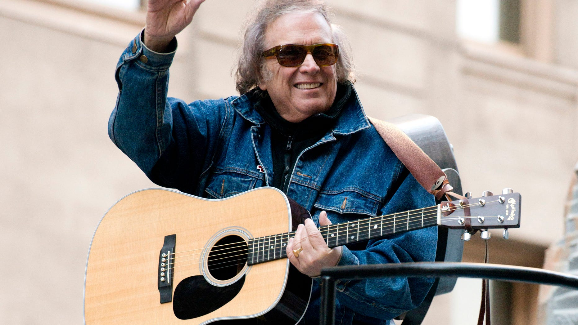 FILE - In this Nov. 22, 2012 file photo, Don McLean rides a float in the Macy's Thanksgiving Day Parade in New York. McLean and his wife have finalized their divorce and agreed to a $10 million settlement.A spokesman for McLean said Monday, June 20, 2016, that the singer chose to ignore a premarital agreement and provide the settlement. (AP Photo/Charles Sykes, File)