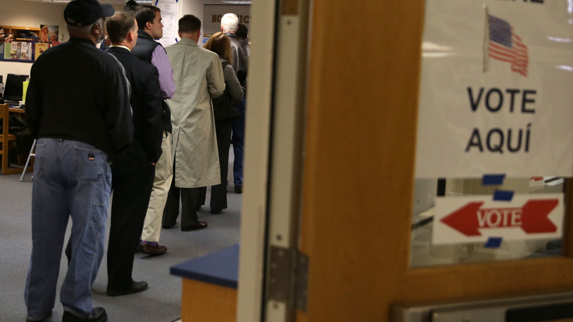 MCLEAN, VA - NOVEMBER 05: Voters line up at a polling station to cast their votes on Election Day November 5, 2013 at Spring Hill Elementary School in McLean, Virginia. Democratic gubernatorial candidate for Virginia Terry McAuliffee is running against Republican Ken Cuccinelli, the current attorney general of Virginia, to succeed Bob McDonnell to be the next Virginia governor. (Photo by Alex Wong/Getty Images)