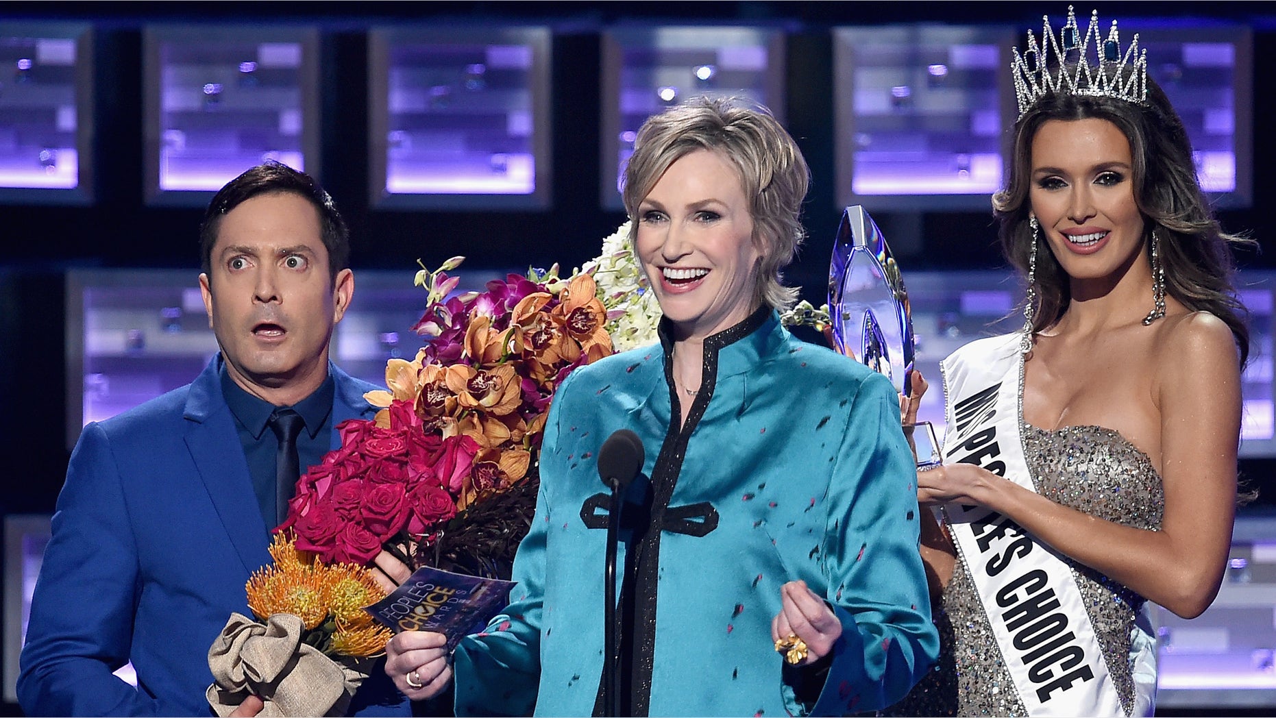 LOS ANGELES, CA - JANUARY 06: (L-R) Actor Thomas Lennon, host Jane Lynch, and Miss Colombia Ariadna Gutierrez perform onstage during the People's Choice Awards 2016 at Microsoft Theater on January 6, 2016 in Los Angeles, California. (Photo by Kevin Winter/Getty Images)