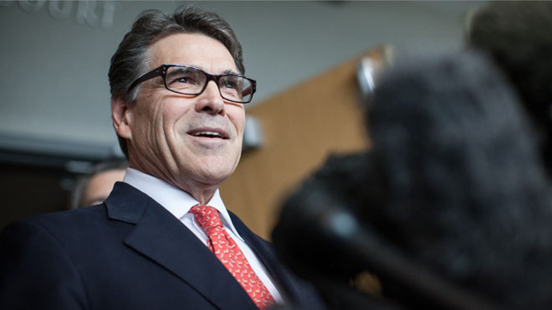 Nov. 6, 2014: Texas Gov. Rick Perry answers questions from the media following a hearing on felony abuse of power charges at the Blackwell-Thurman Criminal Justice Center in Austin, Texas.