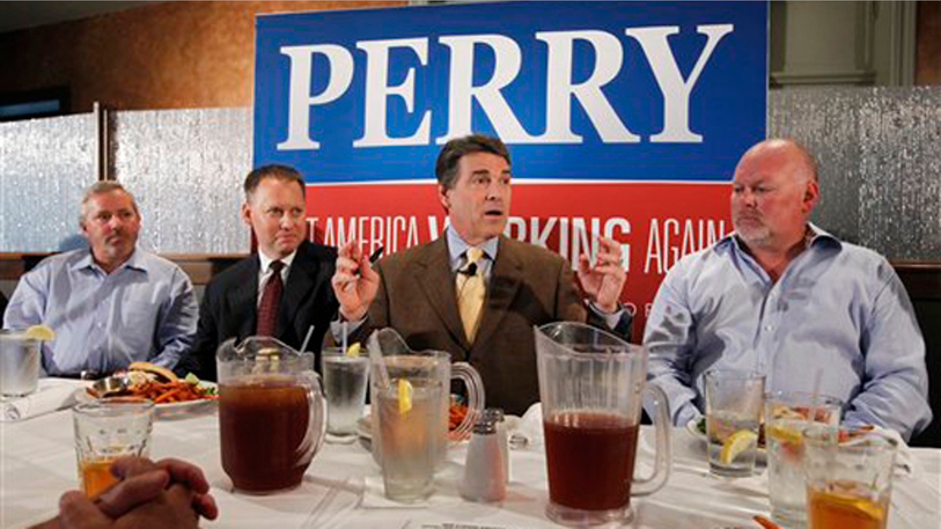 Texas Gov. Rick Perry meets with business leaders at a lunch in Dubuque, Iowa, Aug. 16.