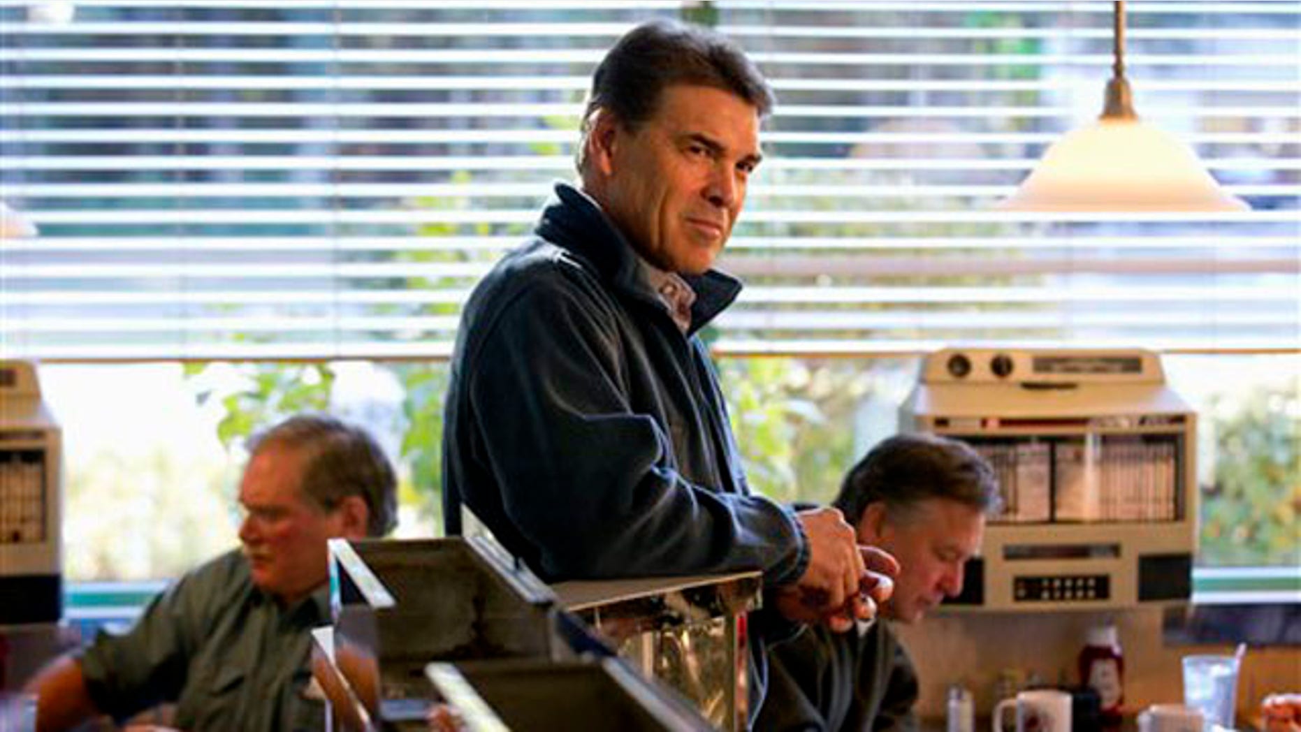 Jan. 13, 2012: Rick Perry waits to be introduced at a campaign stop at the Hilton Head Diner in Hilton Head, S.C.