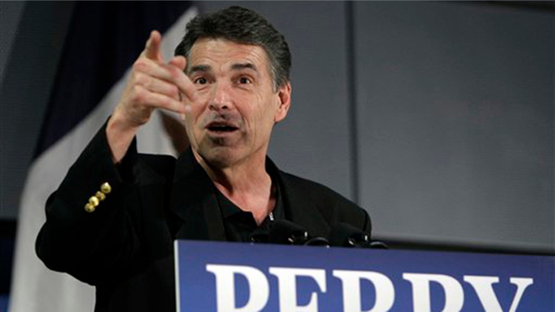 Republican presidential hopeful Texas Gov. Rick Perry speaks during the Johnson County GOP Fall BBQ at Clear Creek-Amana High School, Friday, Oct. 7, 2011, in Tiffin, Iowa.