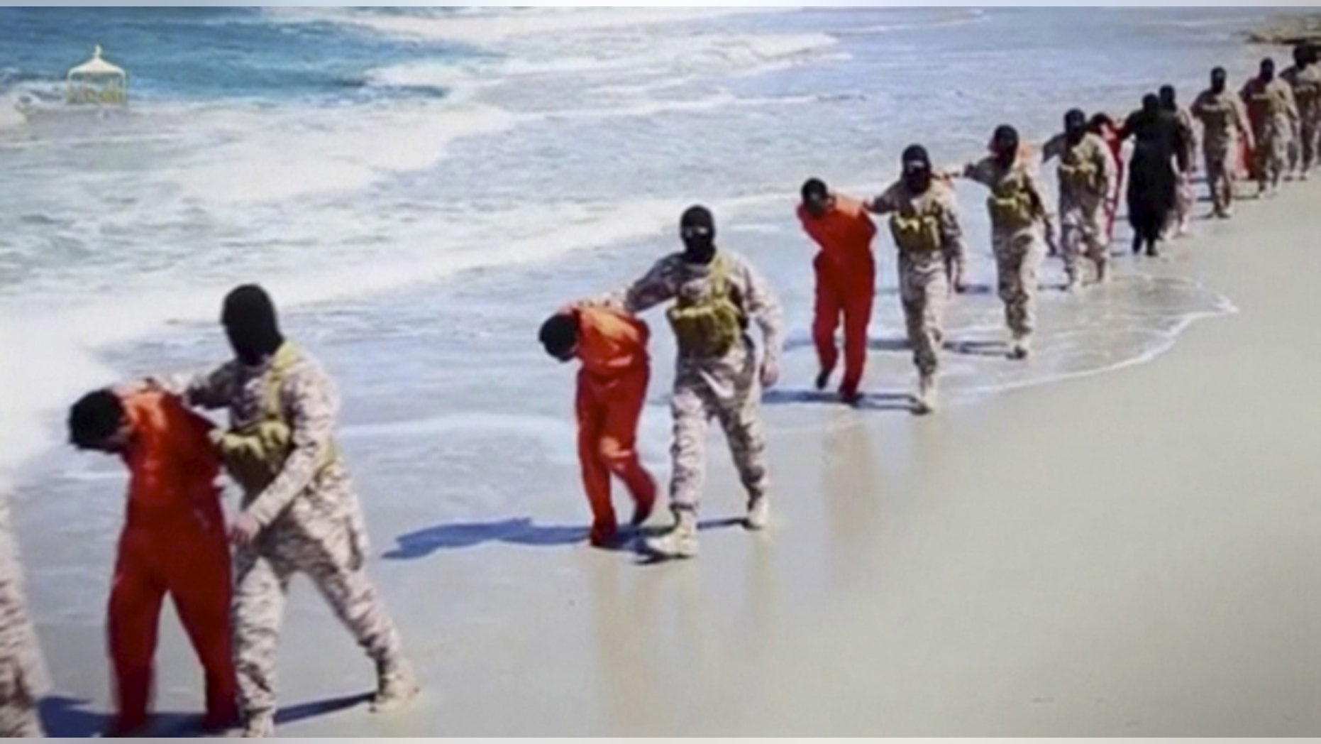Islamic State militants lead what are said to be Ethiopian Christians along a beach in Wilayat Barqa, in this still image from an undated video made available on a social media website on April 19, 2015.