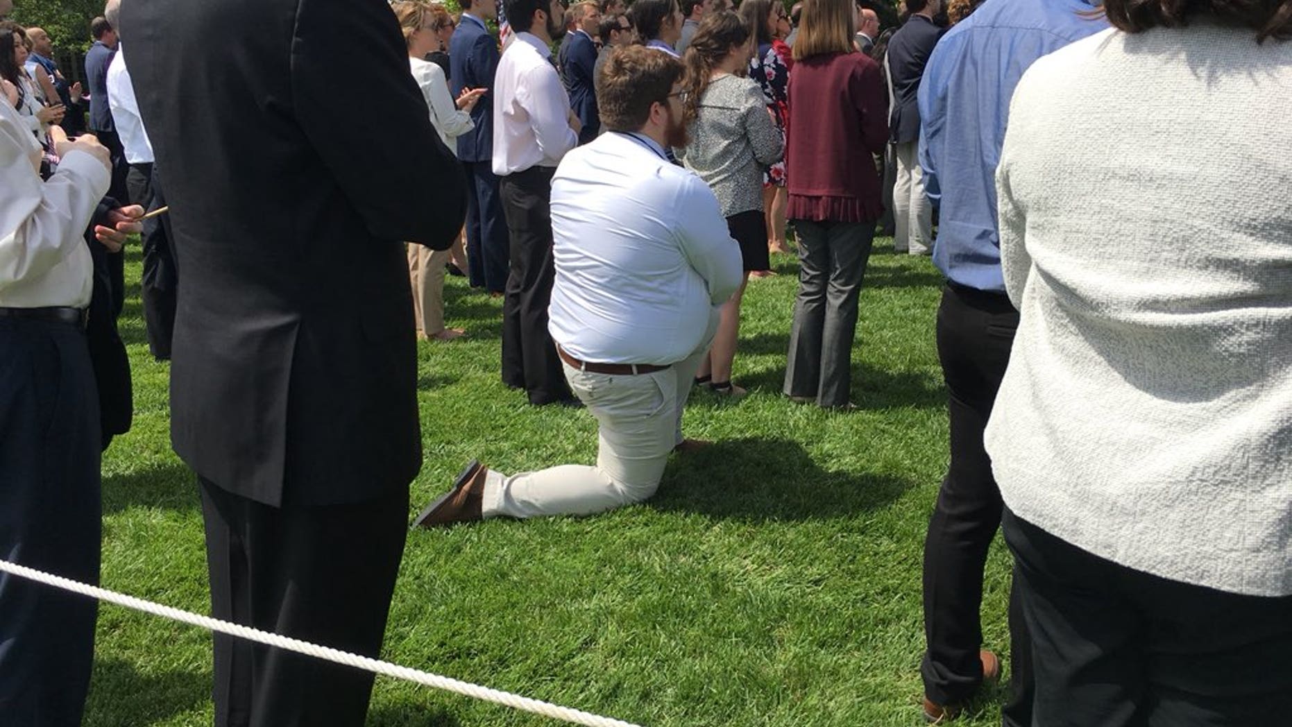 A guest at President Donald Trump's White House event on Tuesday apparently took a knee during the national anthem.