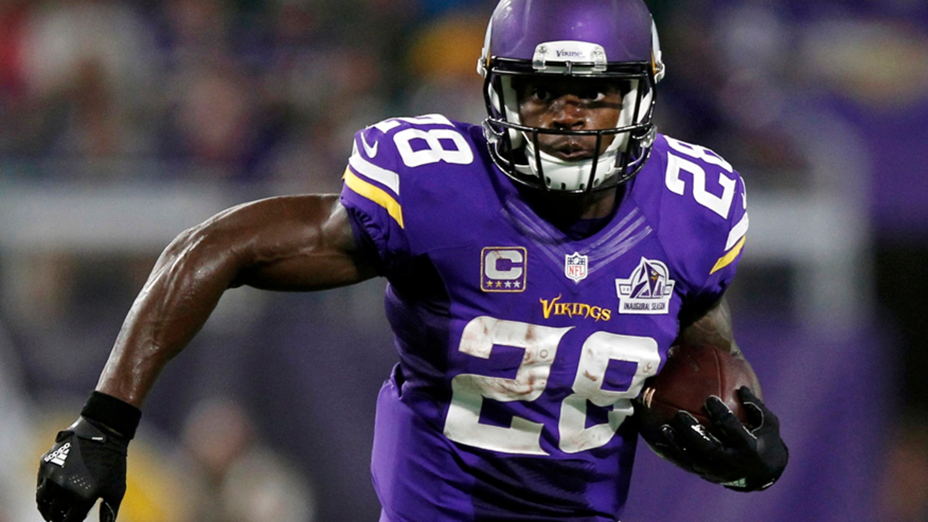 Sept. 18, 2016: Minnesota Vikings running back Adrian Peterson carries the ball during the first half of an NFL football game against the Green Bay Packers in Minneapolis