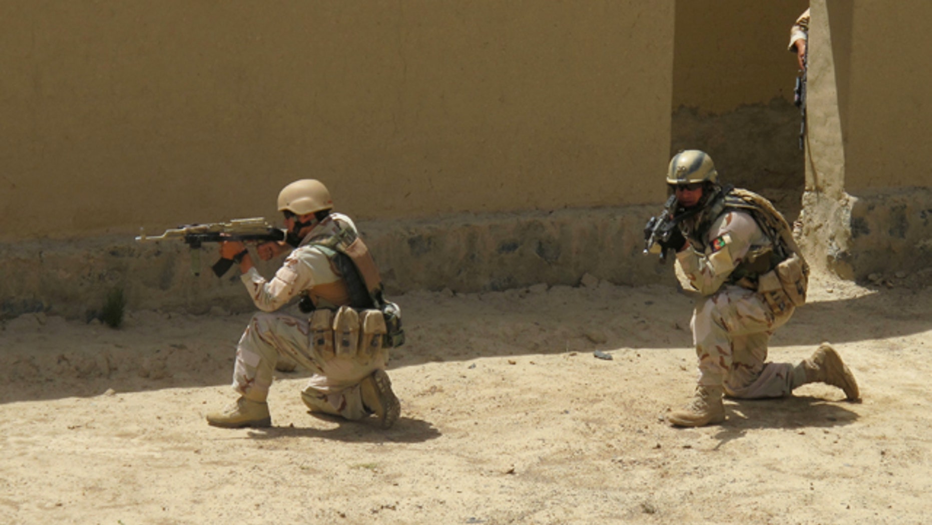 FILE: Afghan Ministry of Interior Security Forces are surveying the scene during a training exercise for military officials just outside of Kabul.