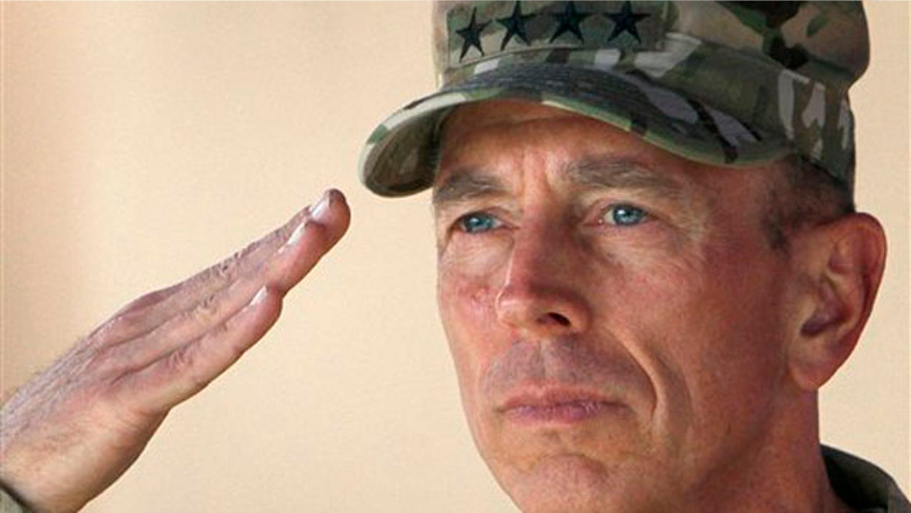 In this July 18 file photo, Gen. David Petraeus salutes during a changing of command ceremony in Kabul, Afghanistan.