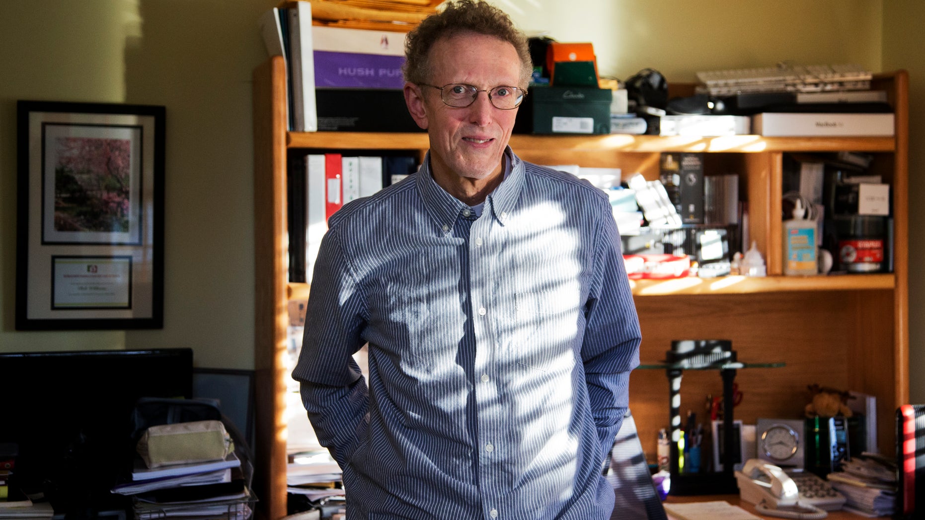Roberton Williams of the Tax Policy Center, poses for a photo in his office at his home in Alexandria, Va., Wednesday, Nov. 11, 2015. (AP Photo/Manuel Balce Ceneta)