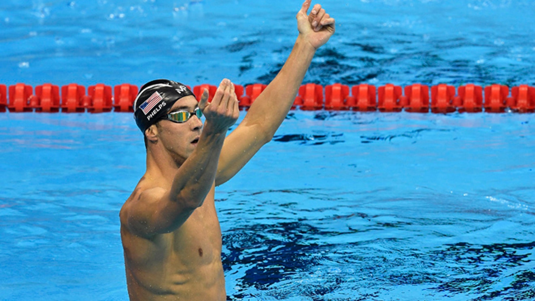 United States' Michael Phelps celebrates after winning the gold medal in the men's 200-meter butterfly final during the swimming competitions at the 2016 Summer Olympics, Tuesday, Aug. 9, 2016, in Rio de Janeiro, Brazil. (AP Photo/Martin Meissner)