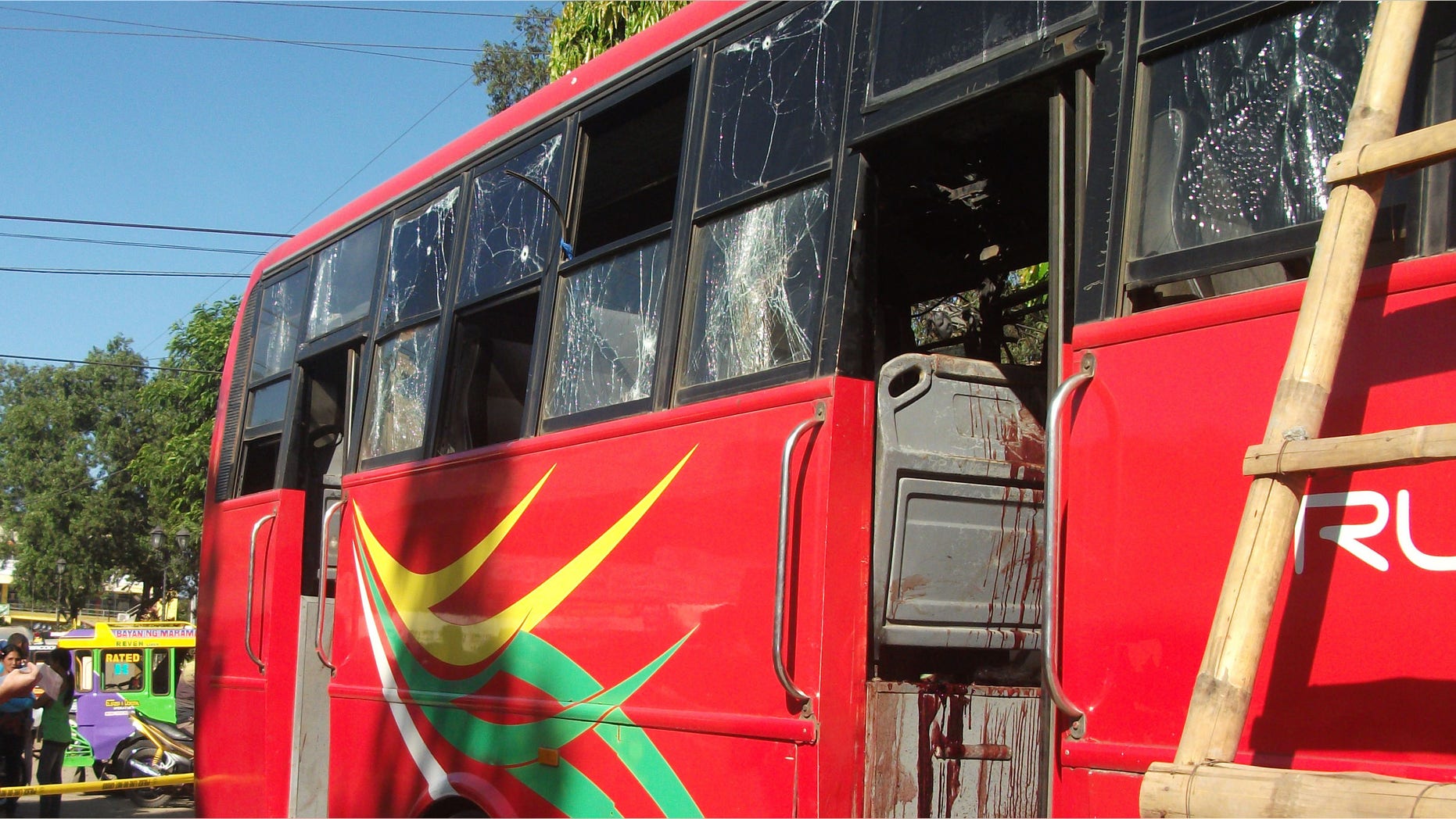 Dec. 10, 2014: Investigators examine the blood-splattered passenger bus