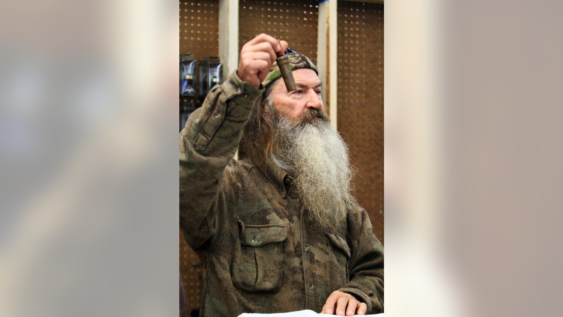 November 7, 2013. Phil Robertson, the Duck Commander, holding the 1 millionth duck call assembled for 2013 at company's warehouse in West Monroe, La.