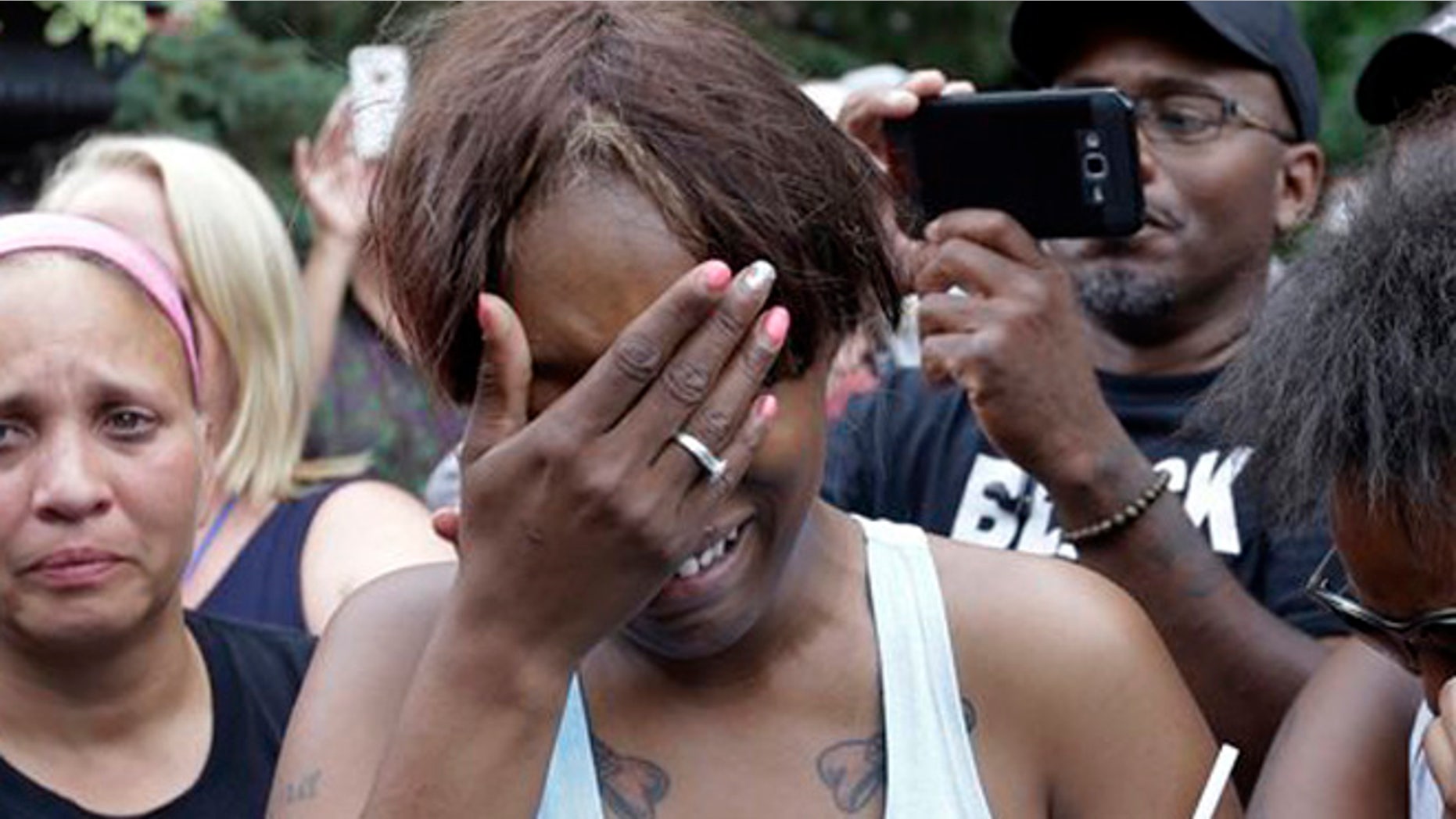 Diamond Reynolds, the girlfriend of Philando Castile of St. Paul, cries outside the governor's residence in St. Paul, Minn., on Thursday, July 7, 2016. Castile was shot and killed after a traffic stop by police in Falcon Heights, Wednesday night. A video shot by Reynolds of the shooting went viral. (AP Photo/Jim Mone)