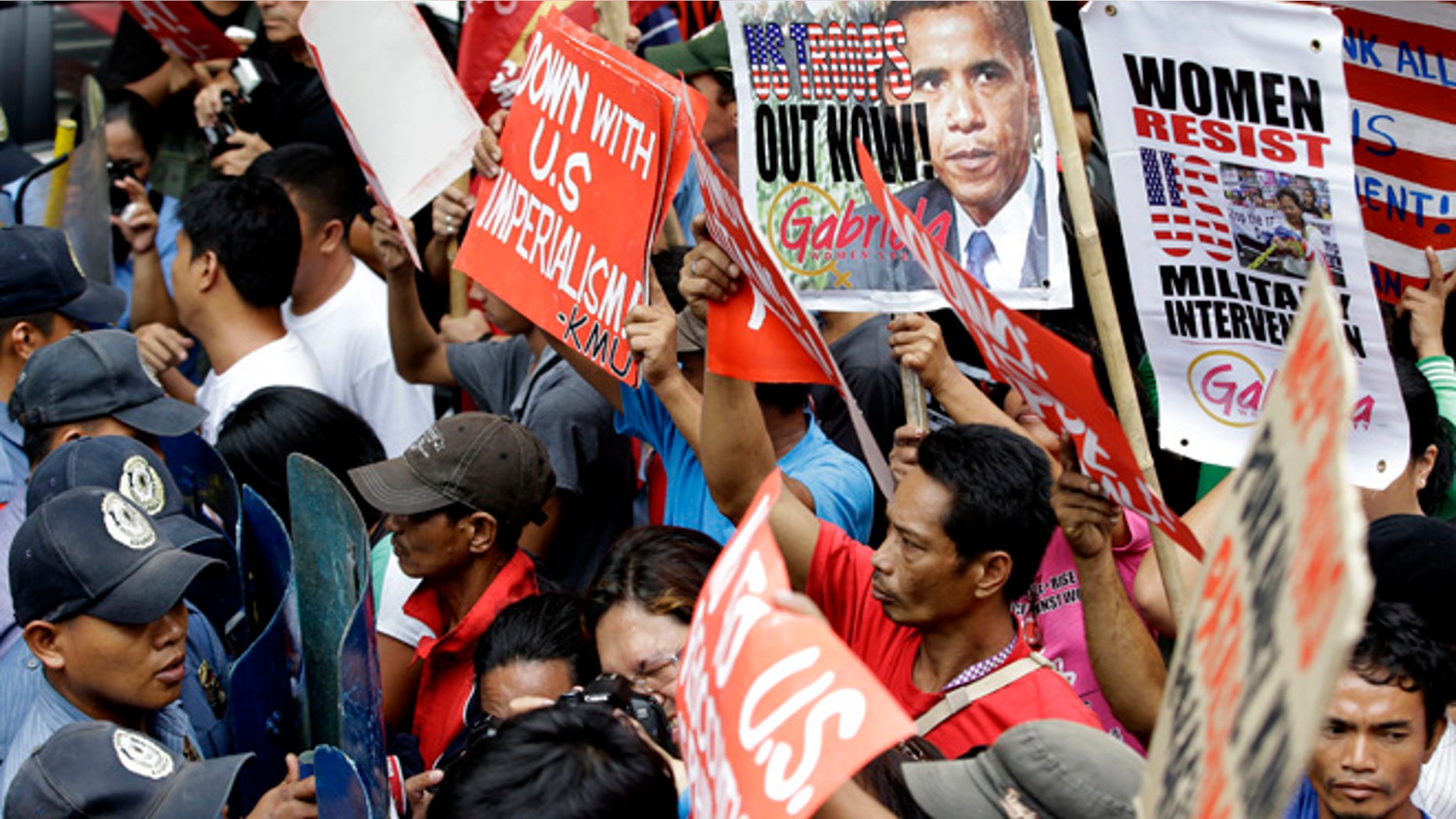 July 4, 2014: Protesters are blocked by police as they try to march closer to the U.S. Embassy to mark Philippine-American Friendship day.