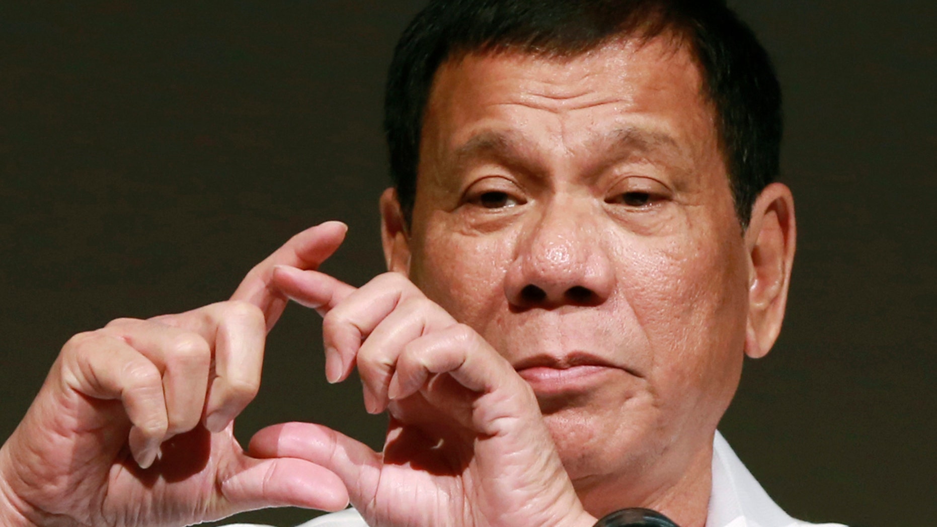FILE - In this Oct. 26, 2016, file photo, Philippine President Rodrigo Duterte delivers a speech at the Philippine Economic Forum in Tokyo.