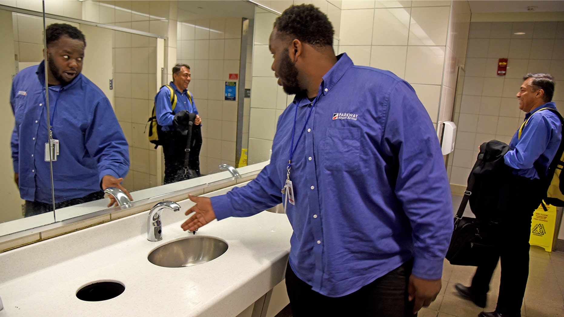 A worker with airport services checks the water pressure at Philadelphia International Airport following the water main breakage on Monday afternoon.